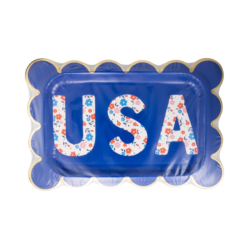 Packaged set of blue scalloped paper plates featuring floral USA letters with gold foil trim.