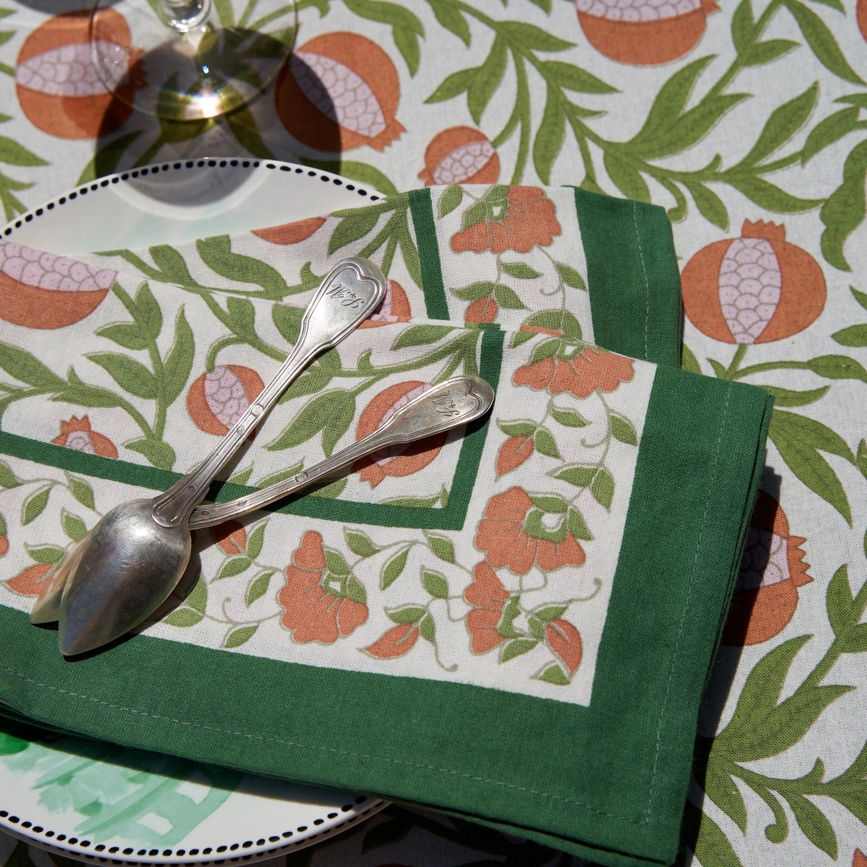 floral cloth napkin in green and orange pomegranate design - perfect for a spring table or an Easter tablescape. These are lovely spring Napkins.