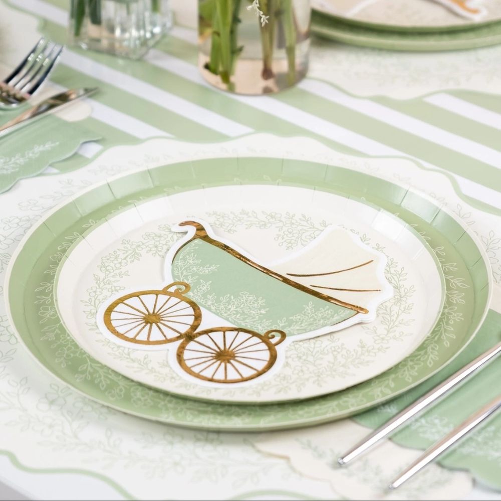 sage pram napkin on placemat and dinner plate.
