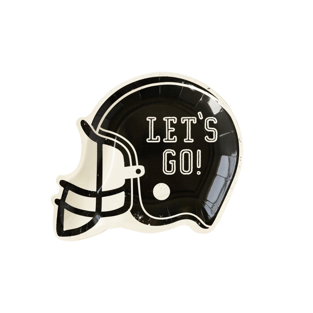 Football party table featuring football helmet shaped paper plates