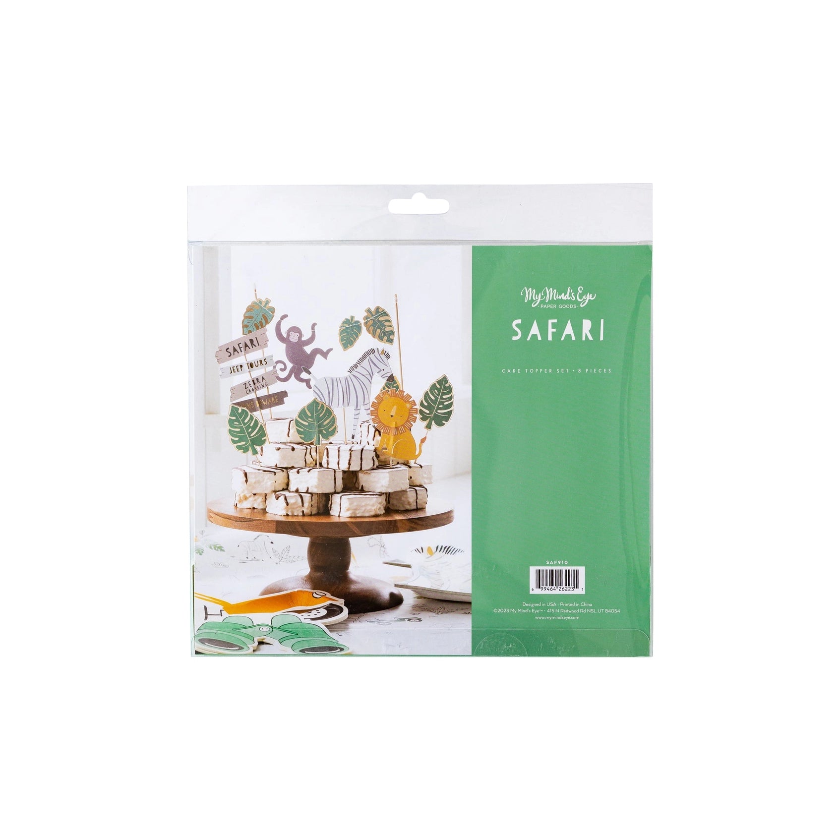 Packaged set of jungle-themed cake toppers with animals and leaves.