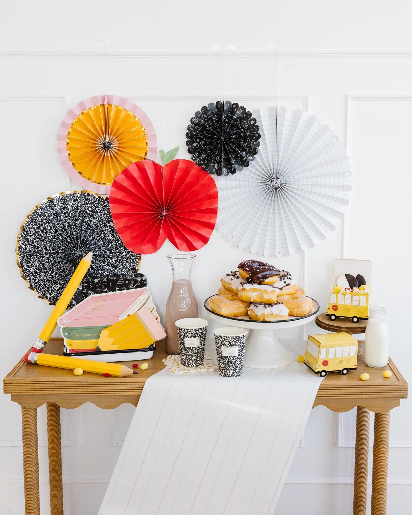 Styled back-to-school snack table featuring pencil napkins and school-themed party supplies.
