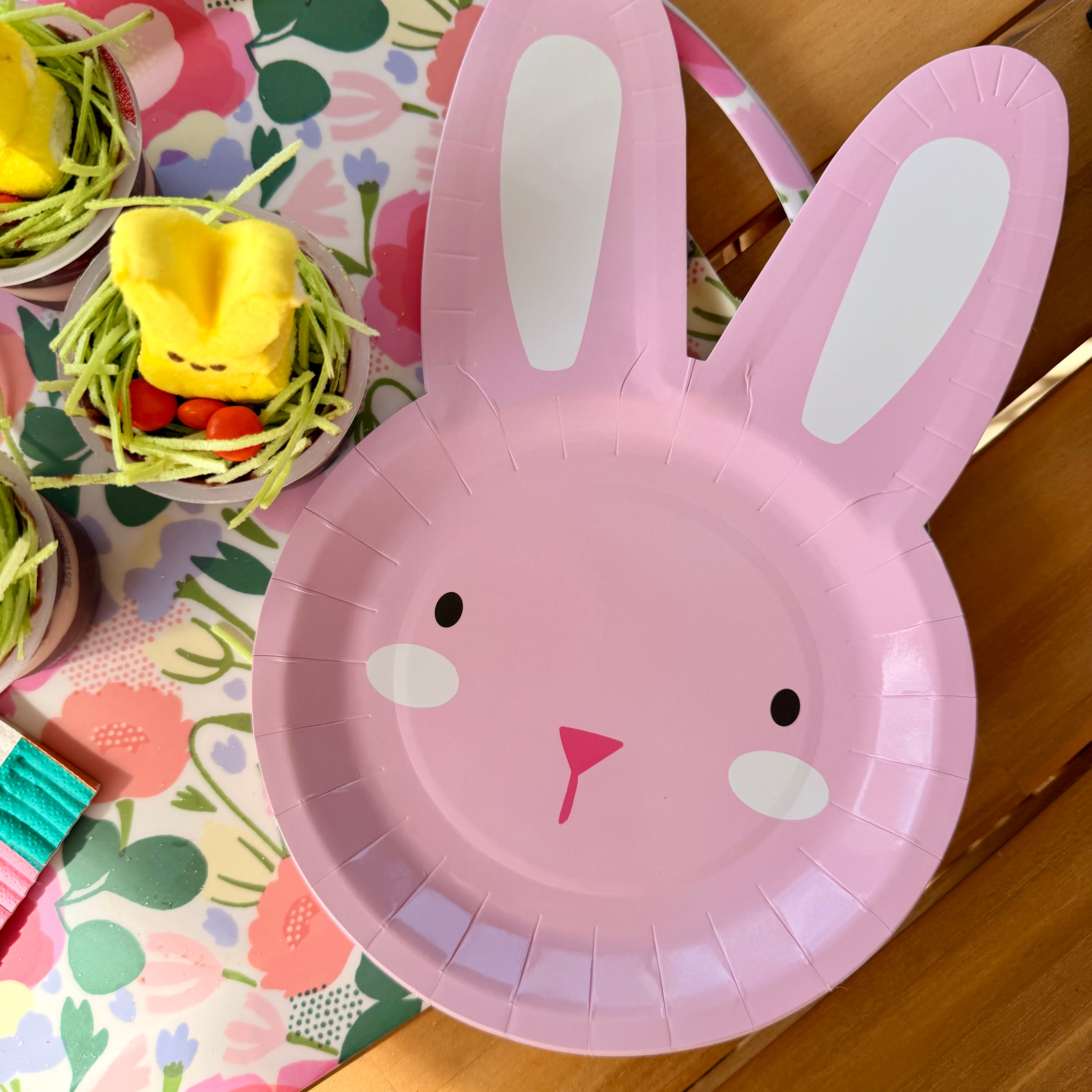 Pink bunny shaped plate in styled flat lay photo