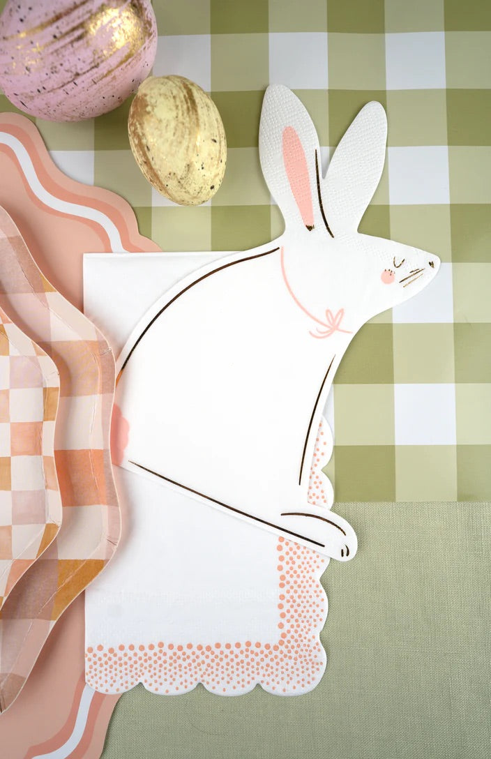 Peach polka dot guest towels matched with a bunny shaped paper napkin