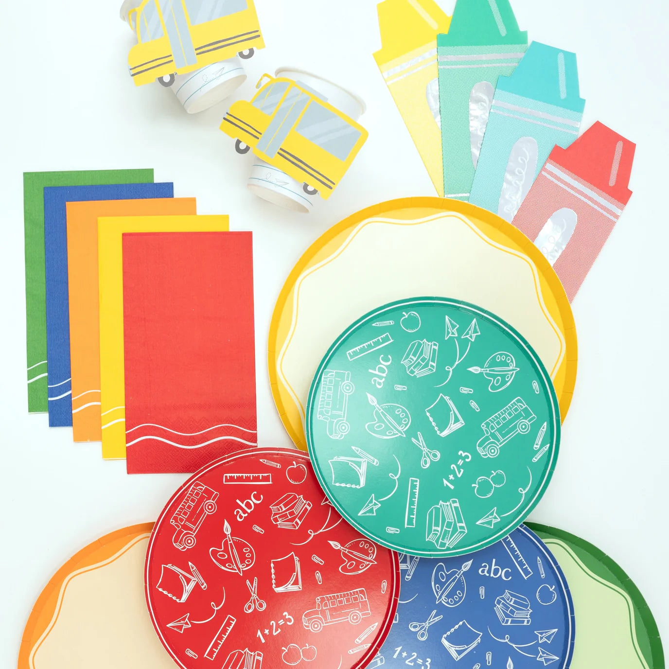 Back to school Flat lay with plates, bus cups, crayons.