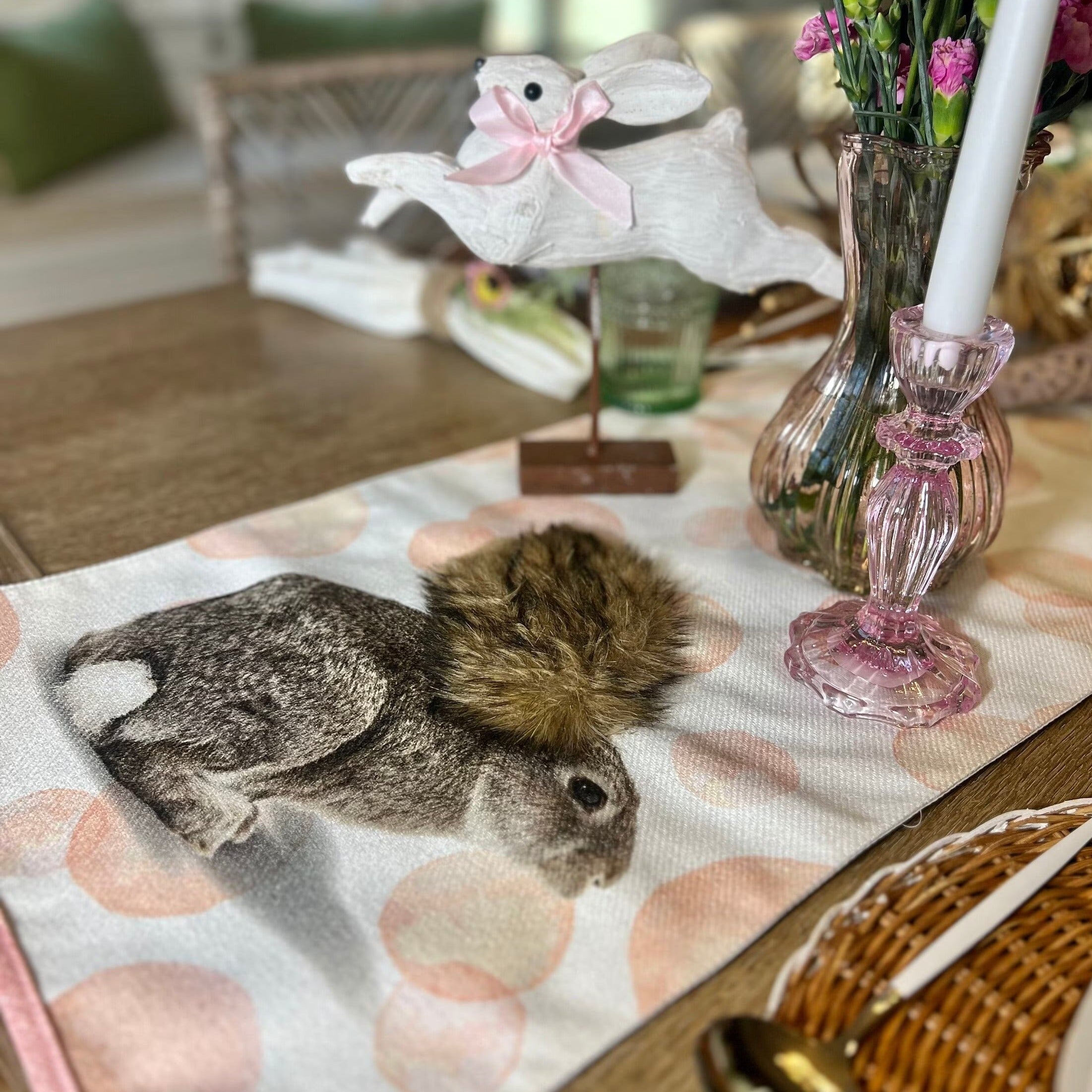 Easter table runner featuring pink polka dots and Easter Bunny design. Shown on an Easter Tablescape.