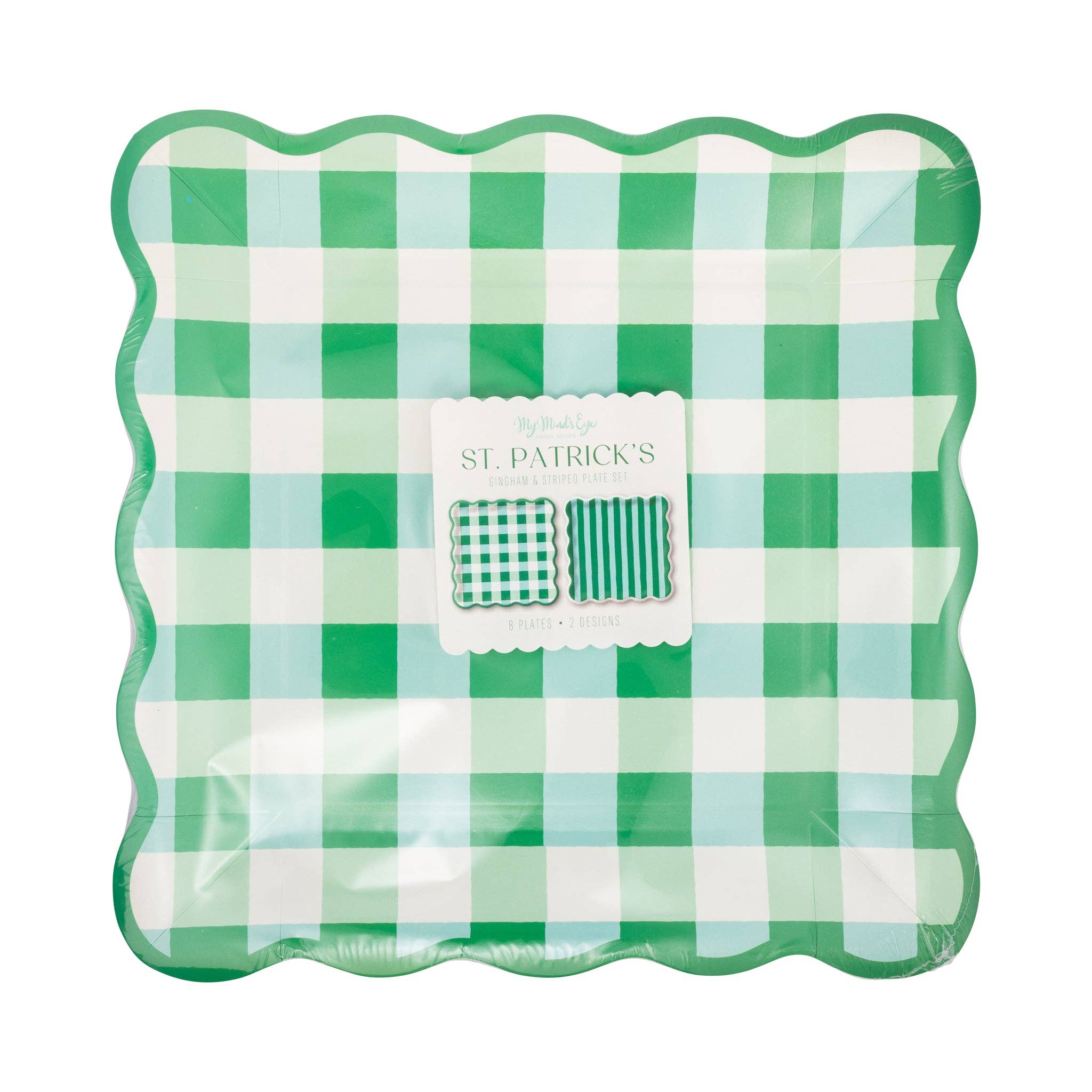 Gingham and stripe green paper plates stacked with scalloped edges in packaging