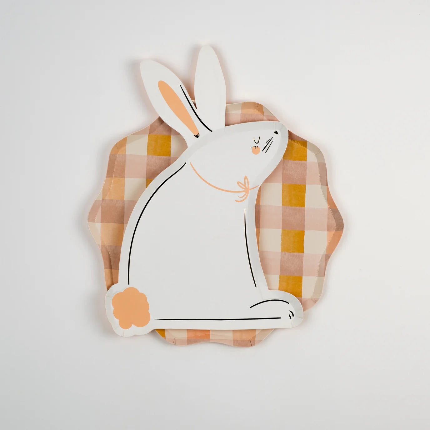 Large pastel plaid dinner plate layered with an illustrated bunny plate, styled for a charming Easter tablescape or spring brunch.