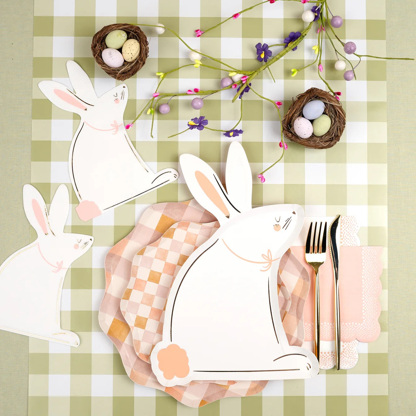 Pastel polka dot cups styled on an Easter brunch table with matching napkins and festive decorations.