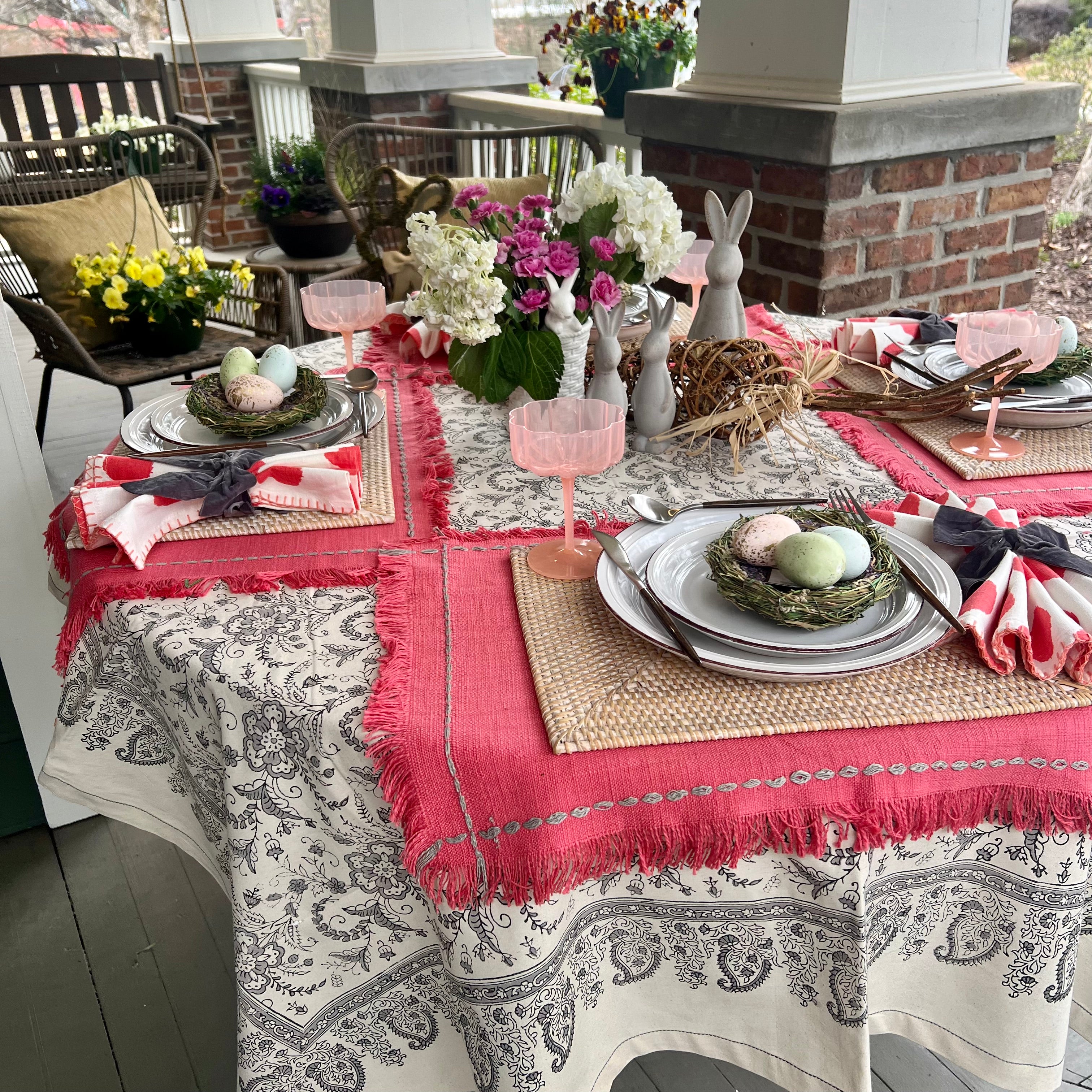 Pink rectangle placemats with fringe and stitching details - perfect for a Spring table.