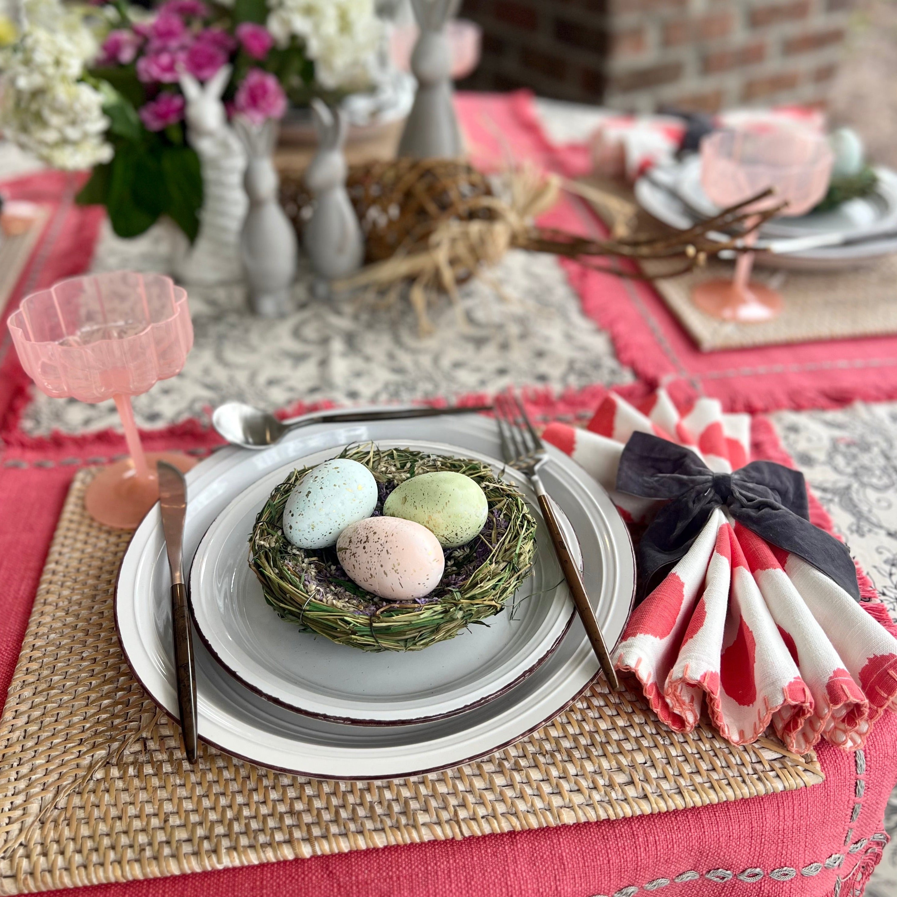 Gray velvet bow napkin ring on a spring table.