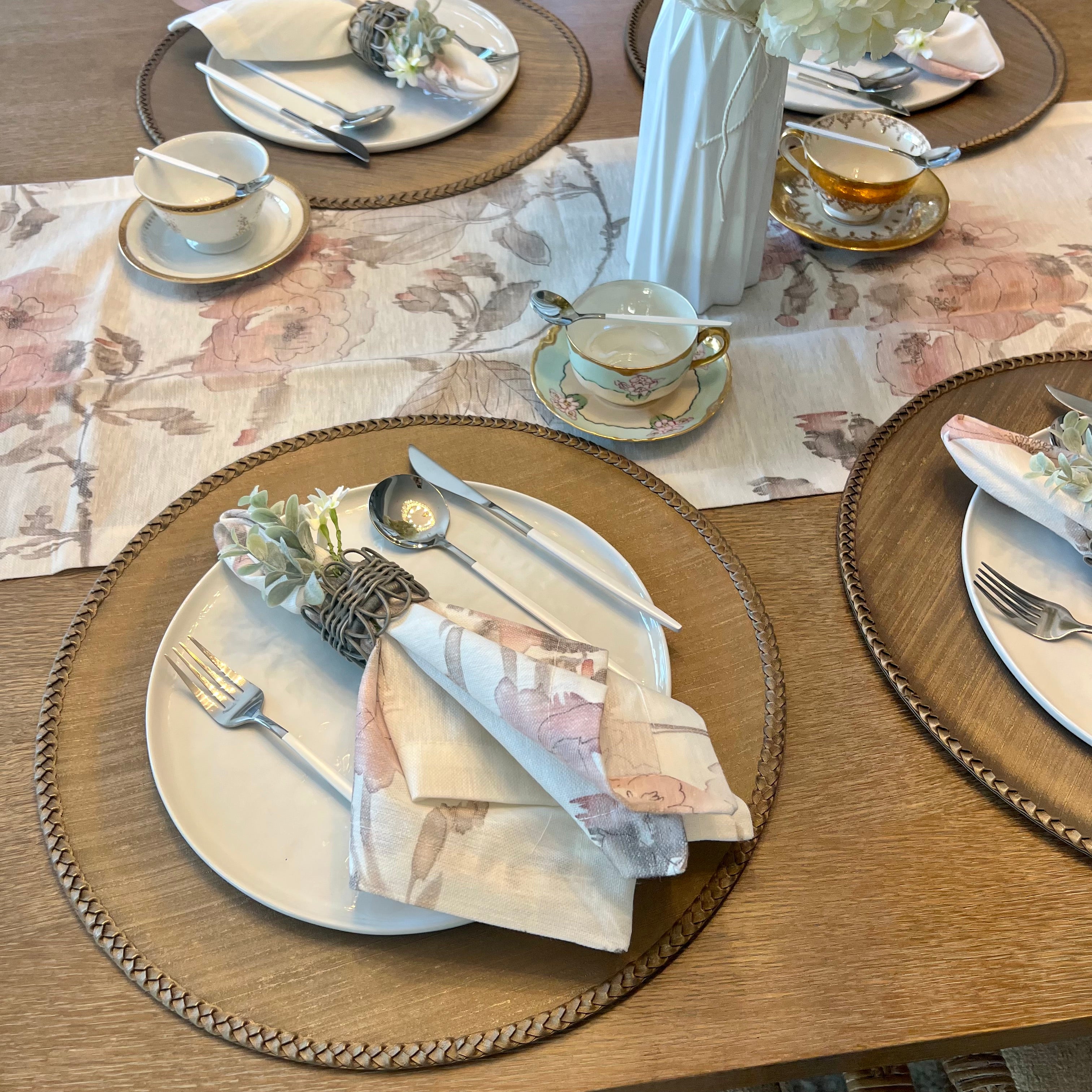Discover the secret to an effortlessly elegant table setting with our taupe Lexington Placemats. These round vinyl wonders not only add a stylish touch to any meal but also promise a quick cleanup with their wipeable surface. Perfect as a Mother's Day gift, they're a chic, practical choice for the discerning hostess.