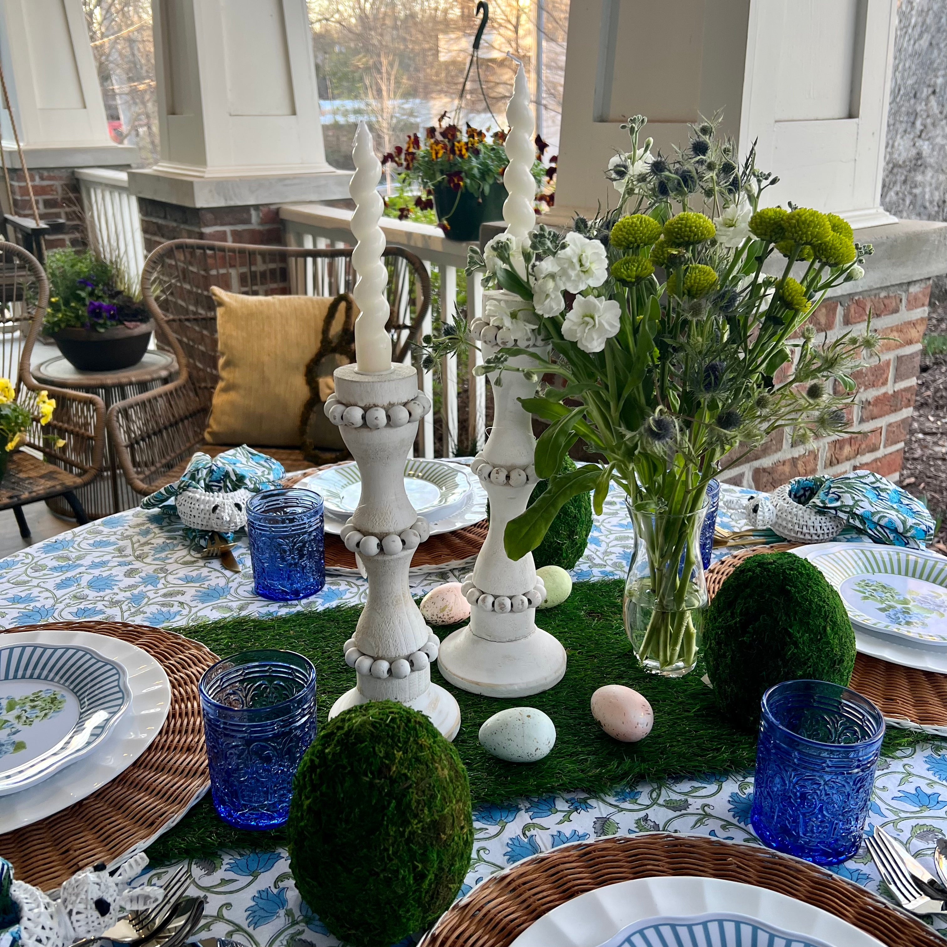 White wooden candle holders that are perfect to use as a centerpiece or throughout the home. These tall candlestick holders are perfect to gift to Mom for Mothers Day
