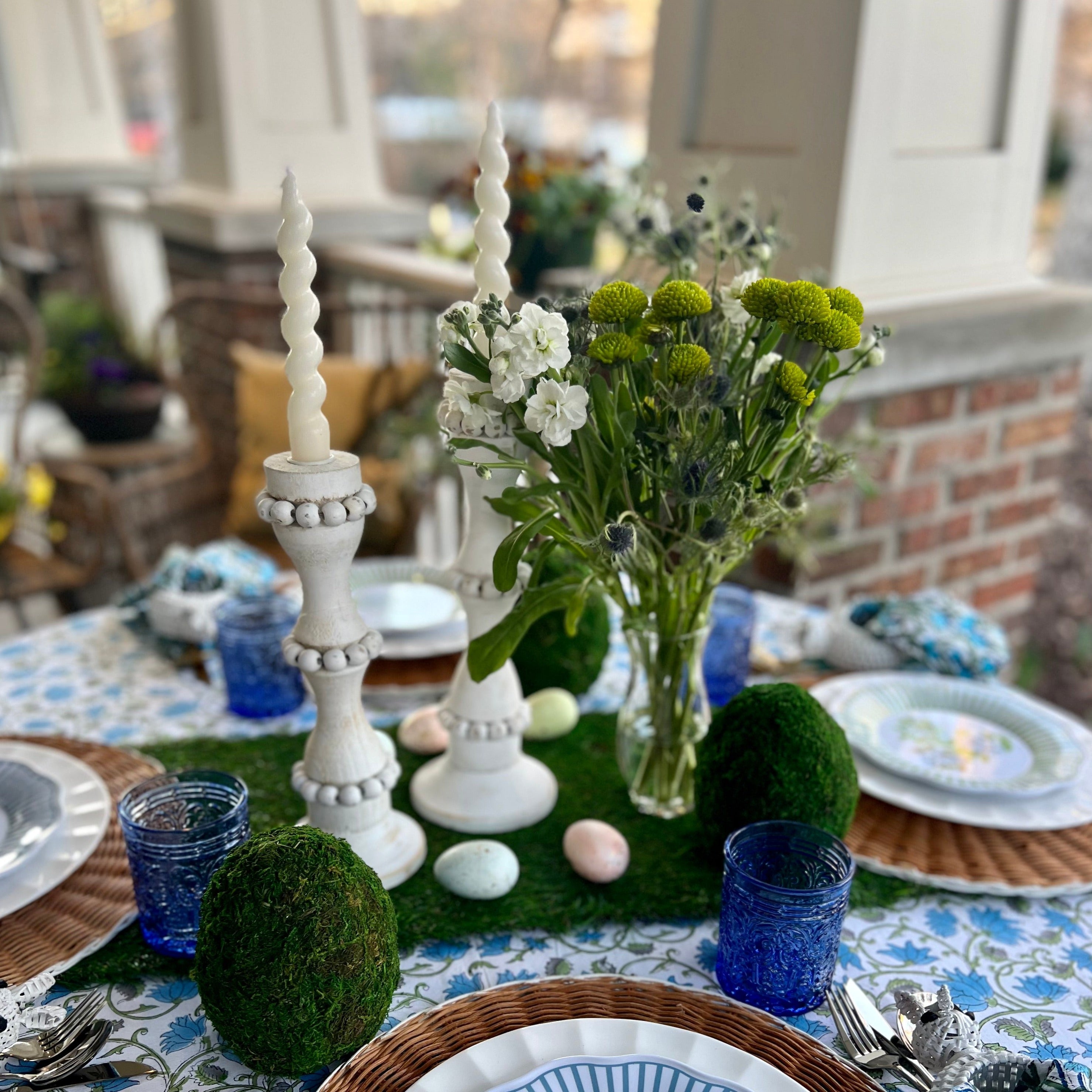 White wooden candle holders that are perfect to use as a centerpiece or throughout the home. These tall candlestick holders are perfect to gift to Mom for Mothers Day