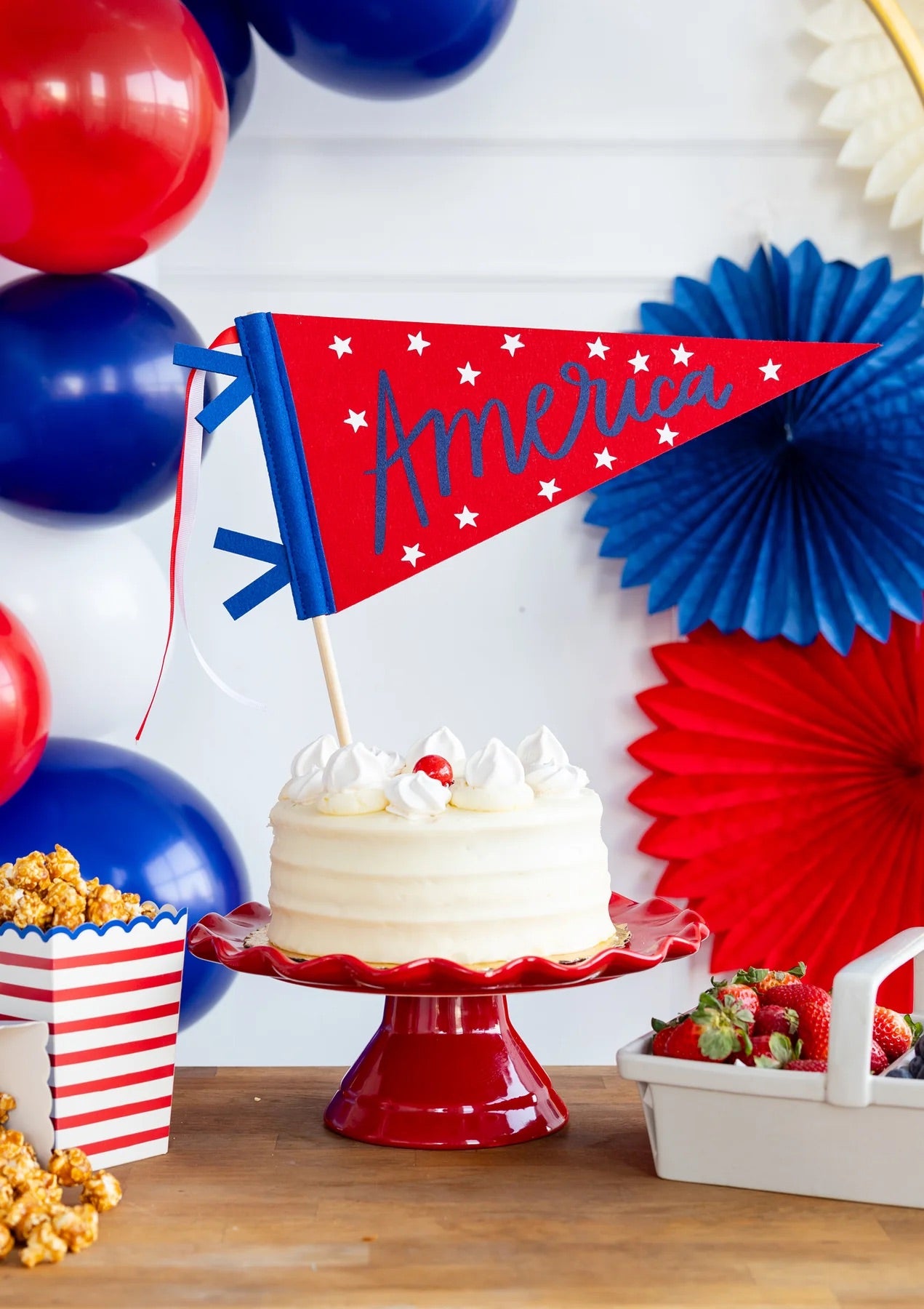 Close-up of a red, white, and blue felt America pennant, perfect for patriotic party decor.