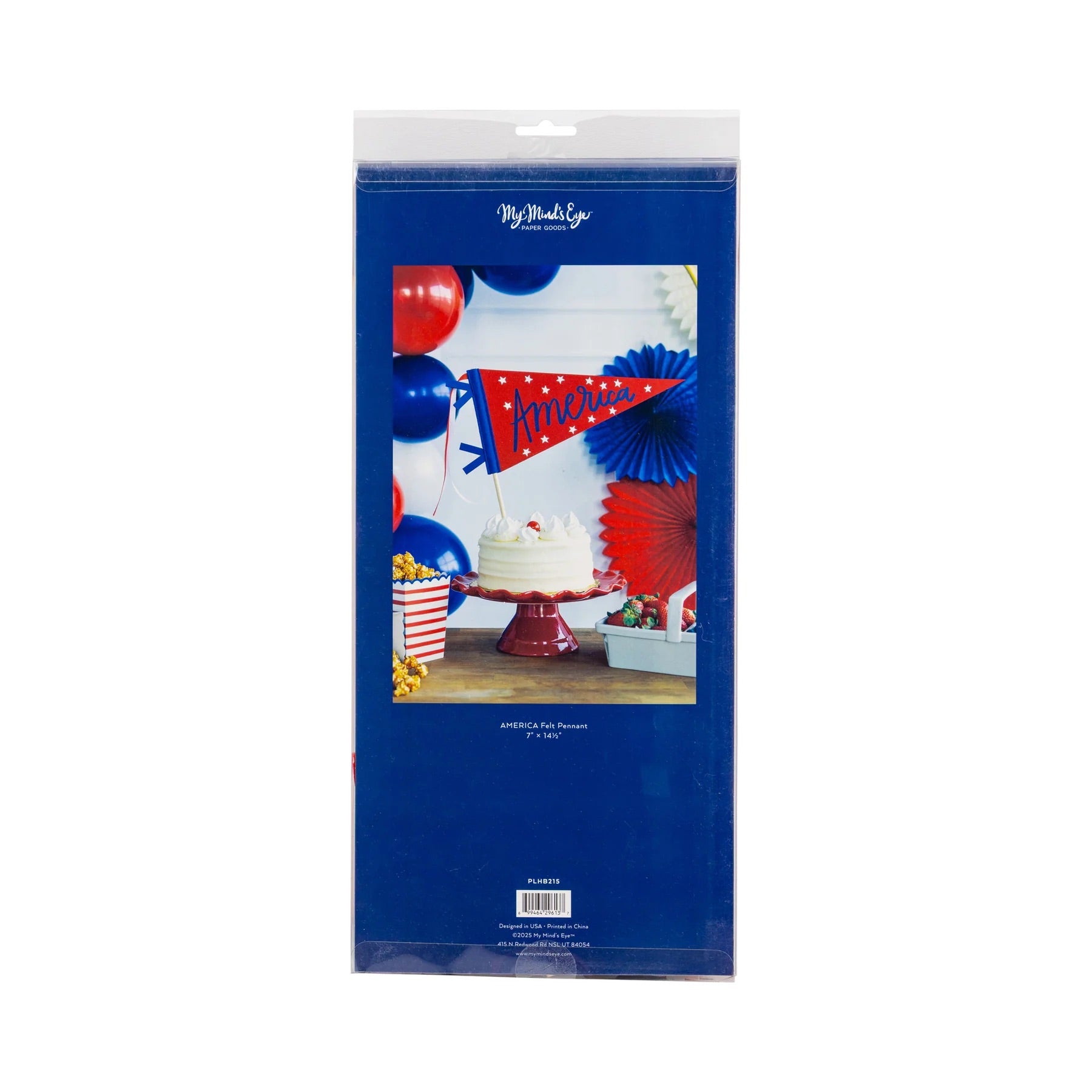 Patriotic pennant cake topper styled on a cake stand with red, white, and blue party decorations.