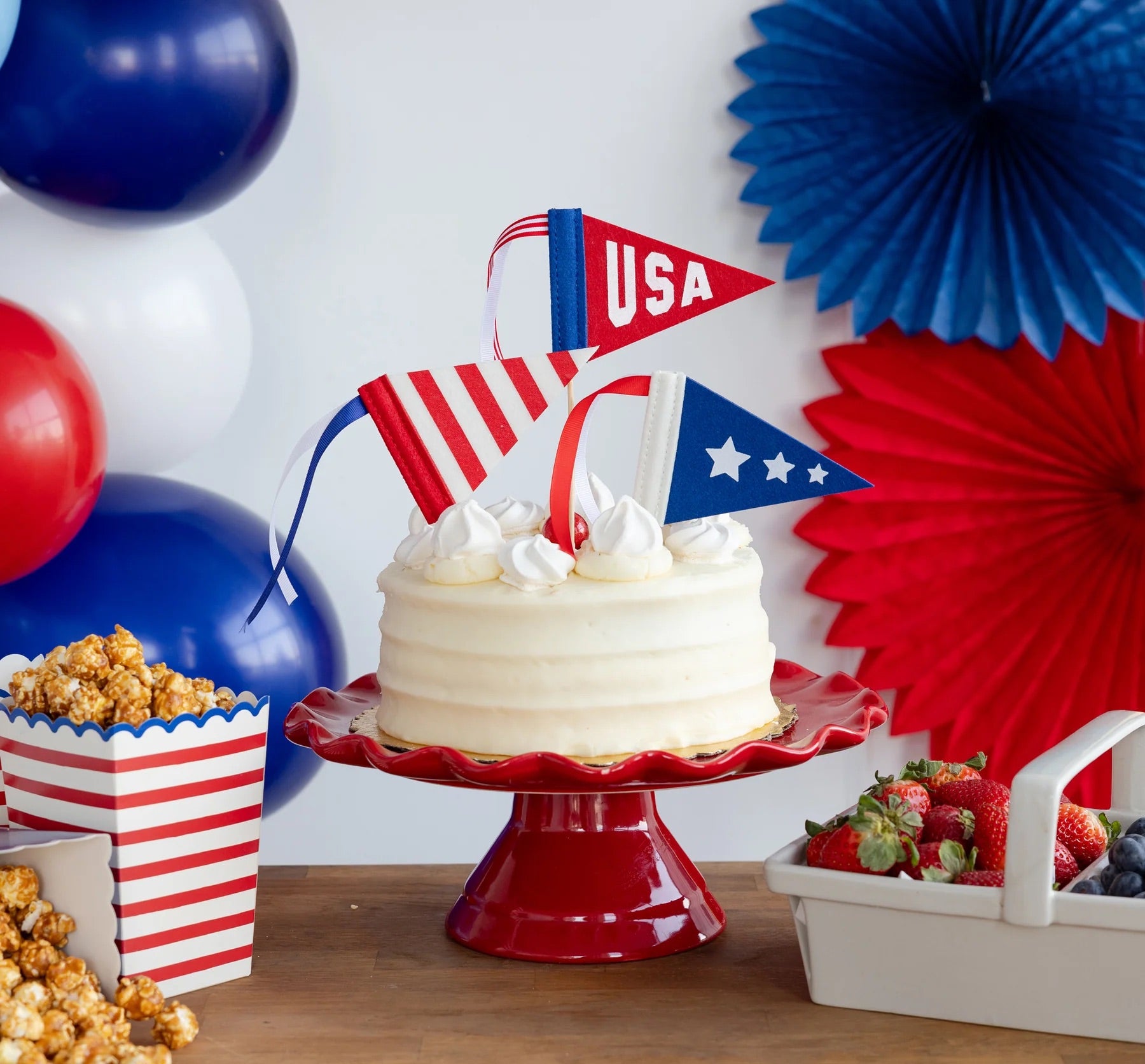 Close-up of festive felt mini-pennants with playful red, white, and blue ribbon accents, suitable for Fourth of July celebrations.