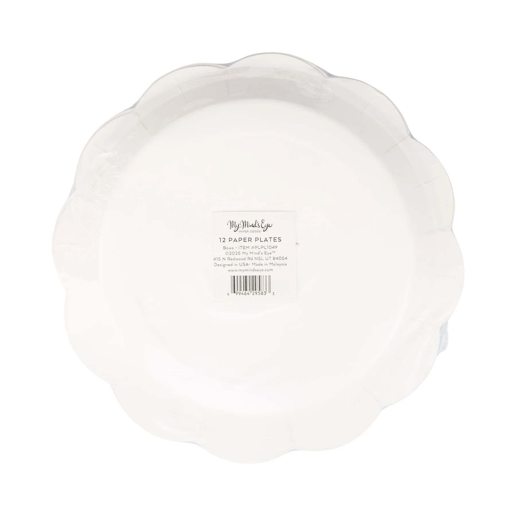 Close-up of scalloped-edge paper plates featuring whimsical bow designs in patriotic colors.