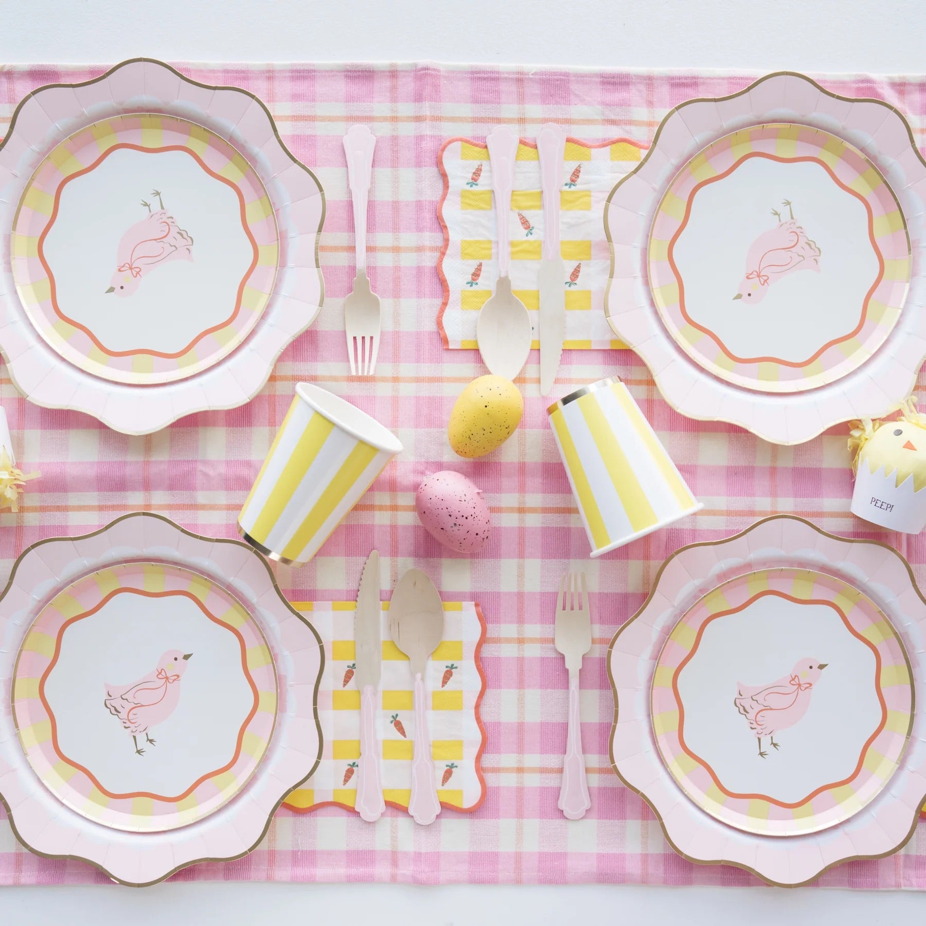 A beautifully styled Easter table featuring Sweet Carrot Easter napkins paired with matching pastel tableware, fresh florals, and festive decorations for a charming seasonal setup.