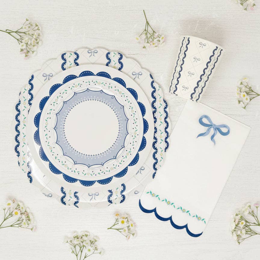 Blue bow napkin paired with matching scalloped plates