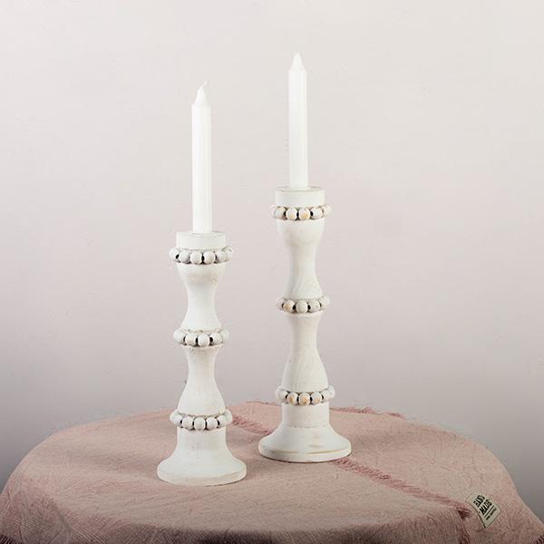 White wooden candle holders that are perfect to use as a centerpiece or throughout the home. These tall candlestick holders are perfect to gift to Mom for Mothers Day