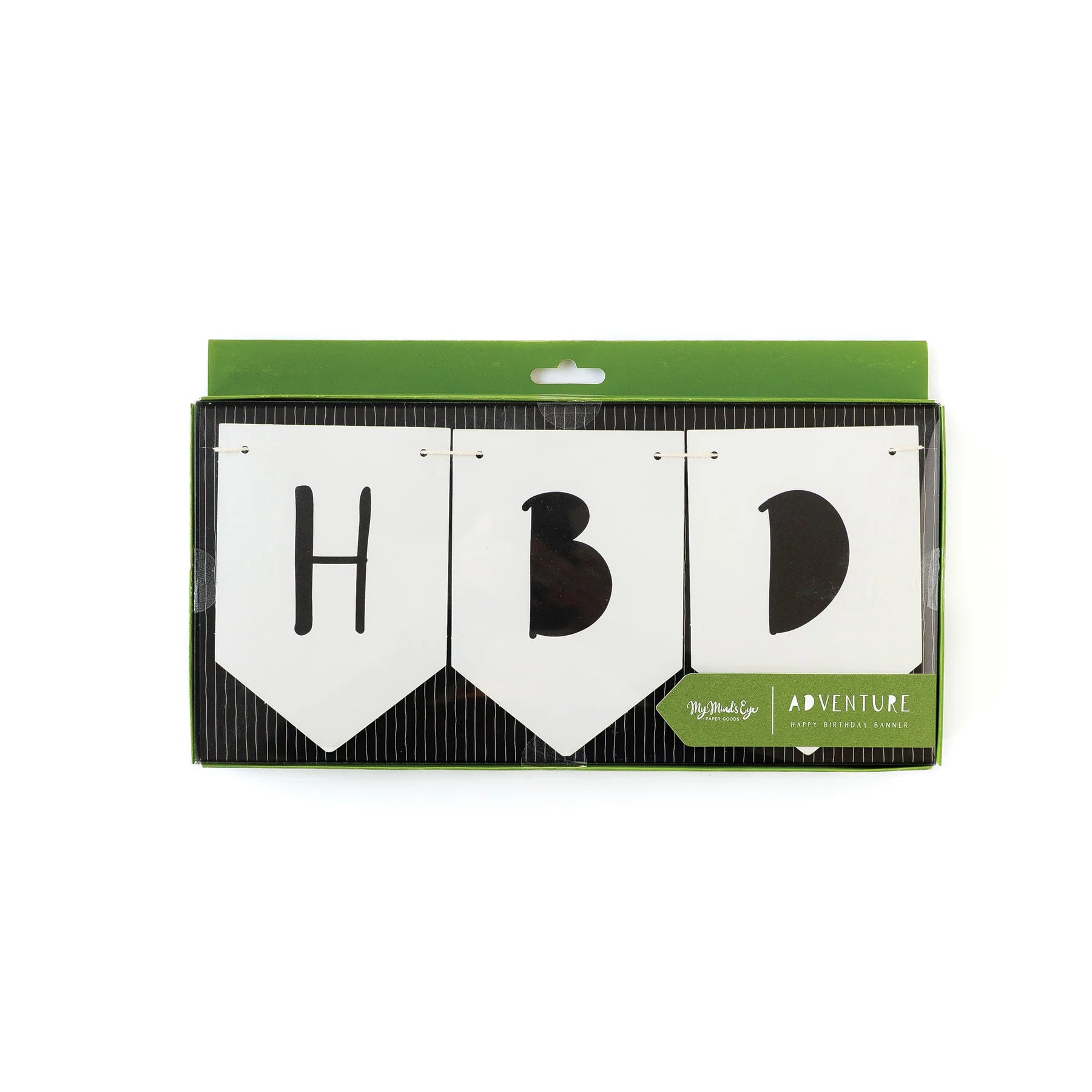 Close-up of banner letters “HBD” in stylized black font on white cardstock, inside original packaging with green accents.