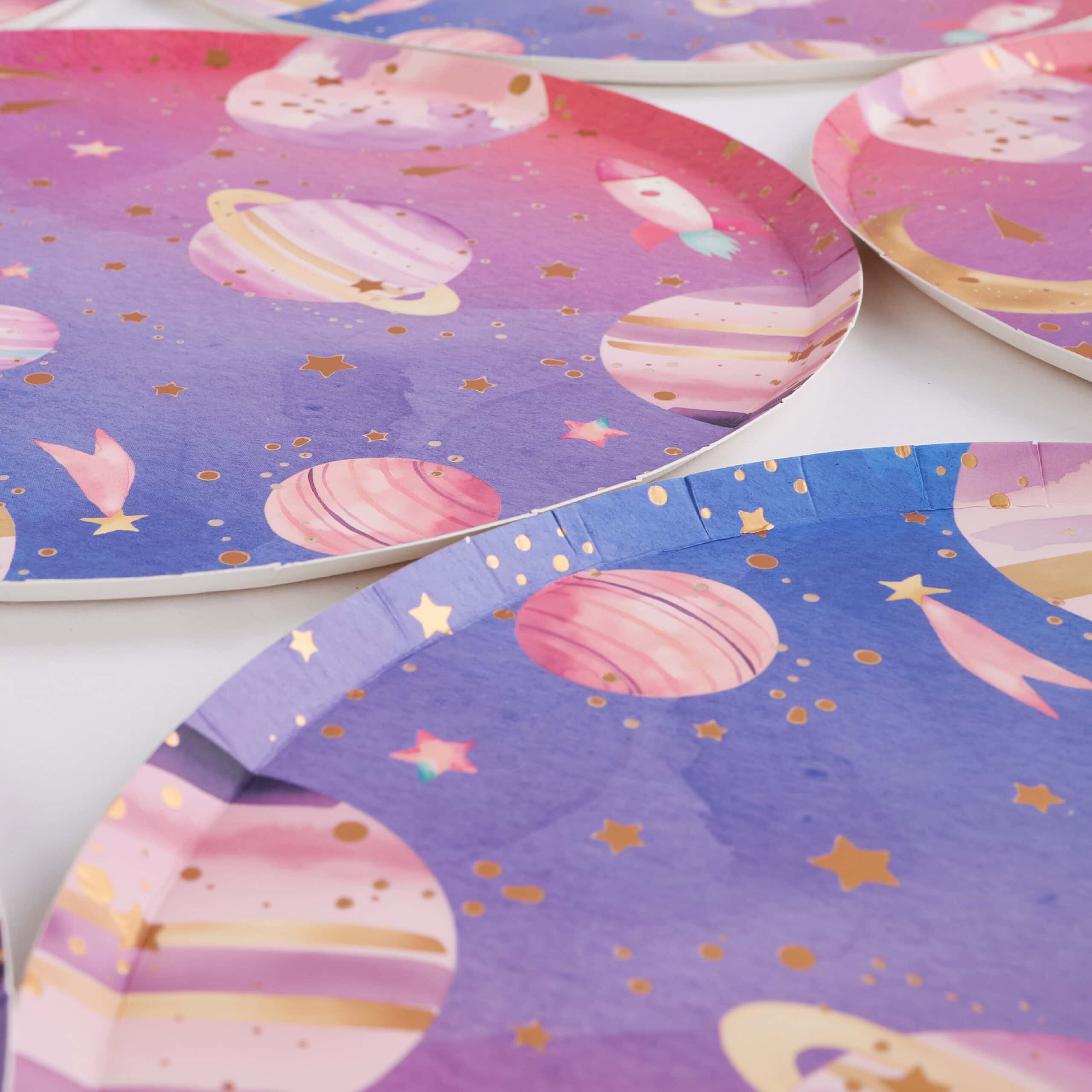 angled view of galaxy paper plates with planet design