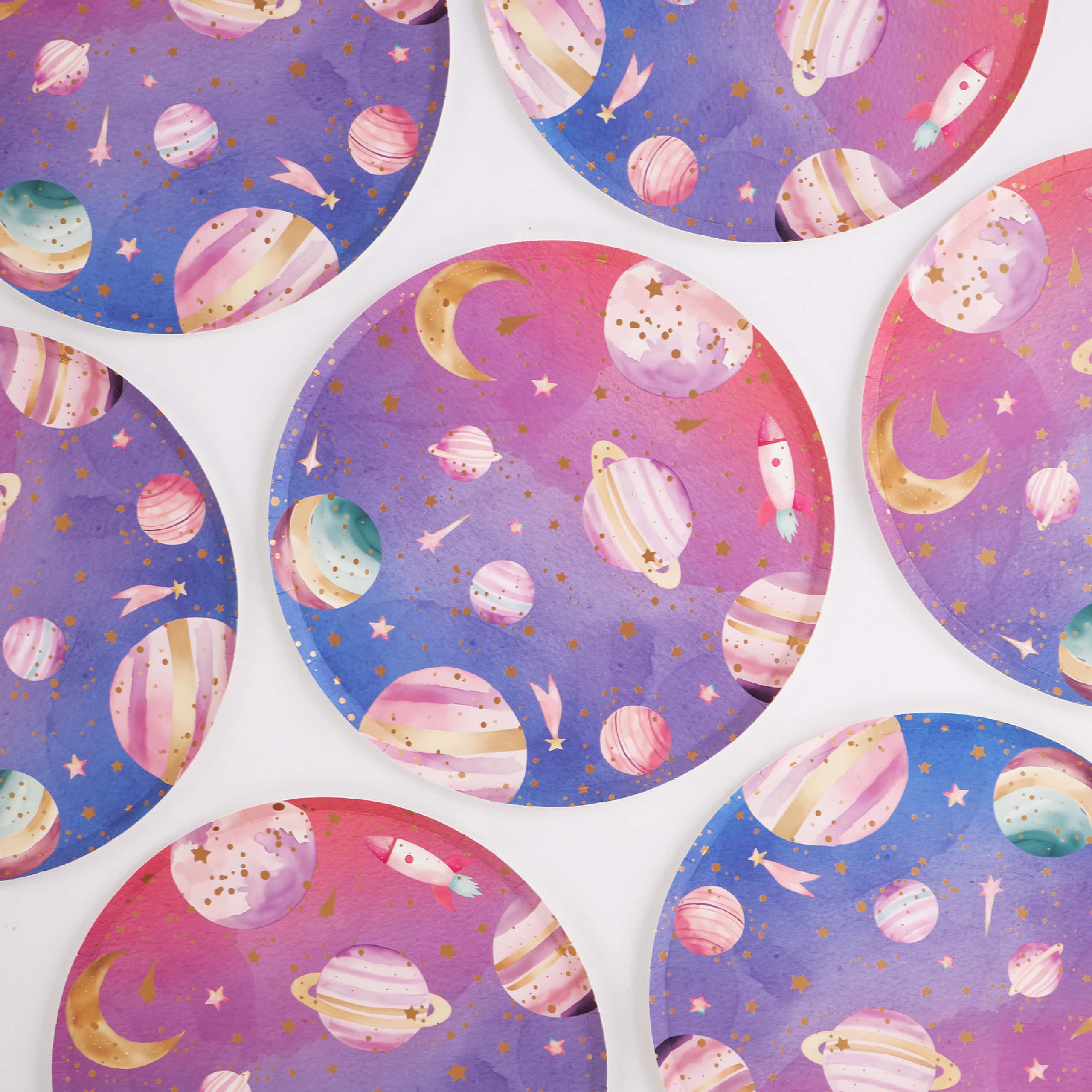 assorted galaxy paper plates arranged in space theme