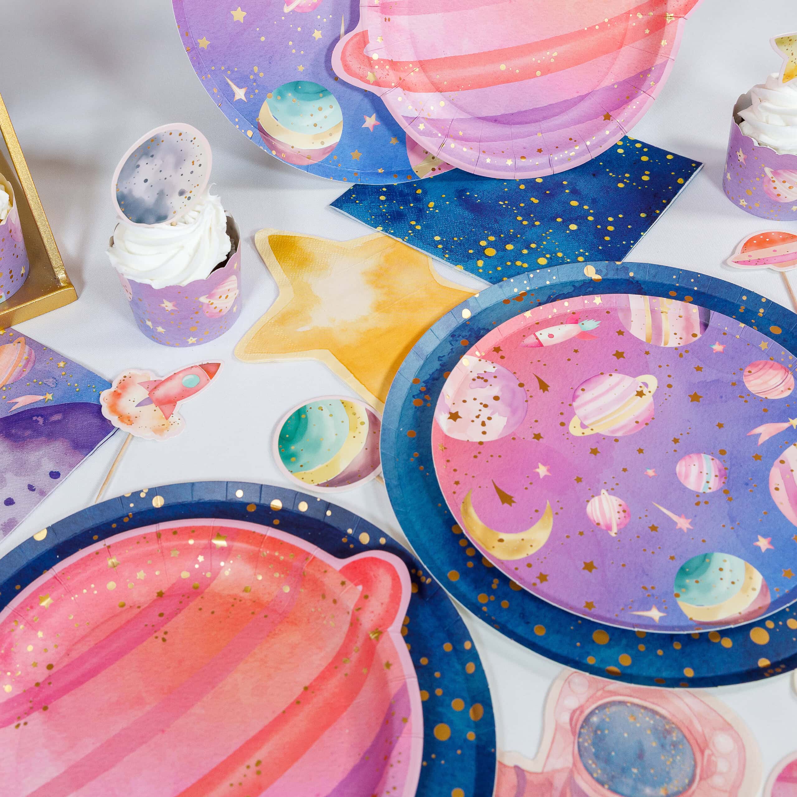 astronaut birthday table setup with planet and galaxy plates