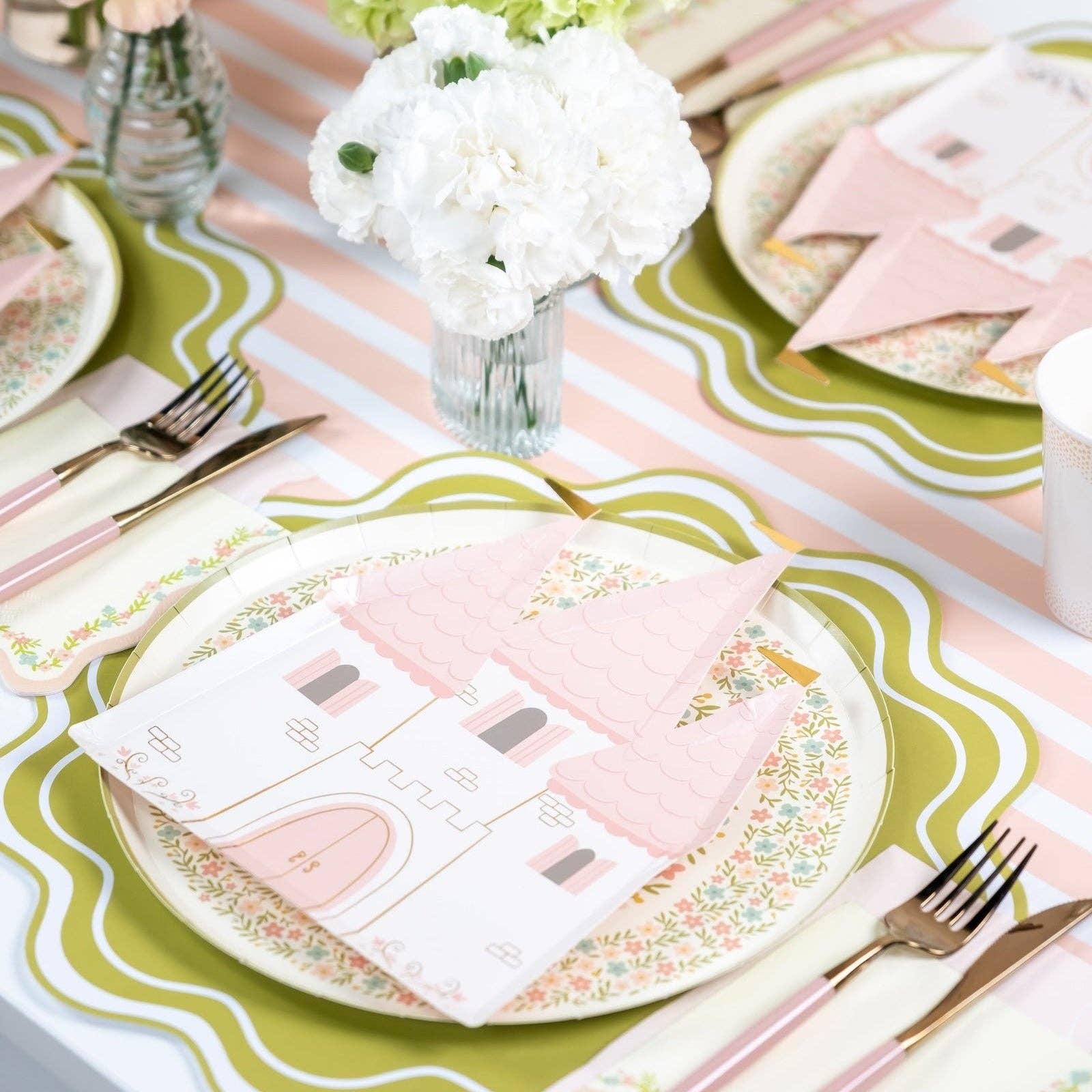 Pink striped table runner styled with princess plates and gold cutlery