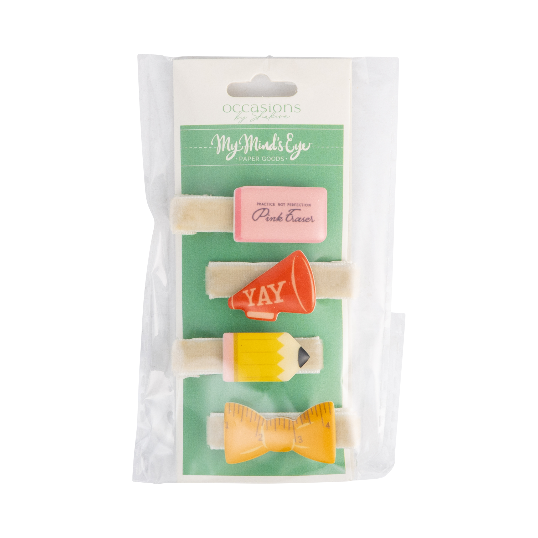 Front of back to school hair barrette set in packaging showing four clips — pink eraser, red YAY megaphone, yellow pencil, and yellow ruler bow — on cream velvet bases