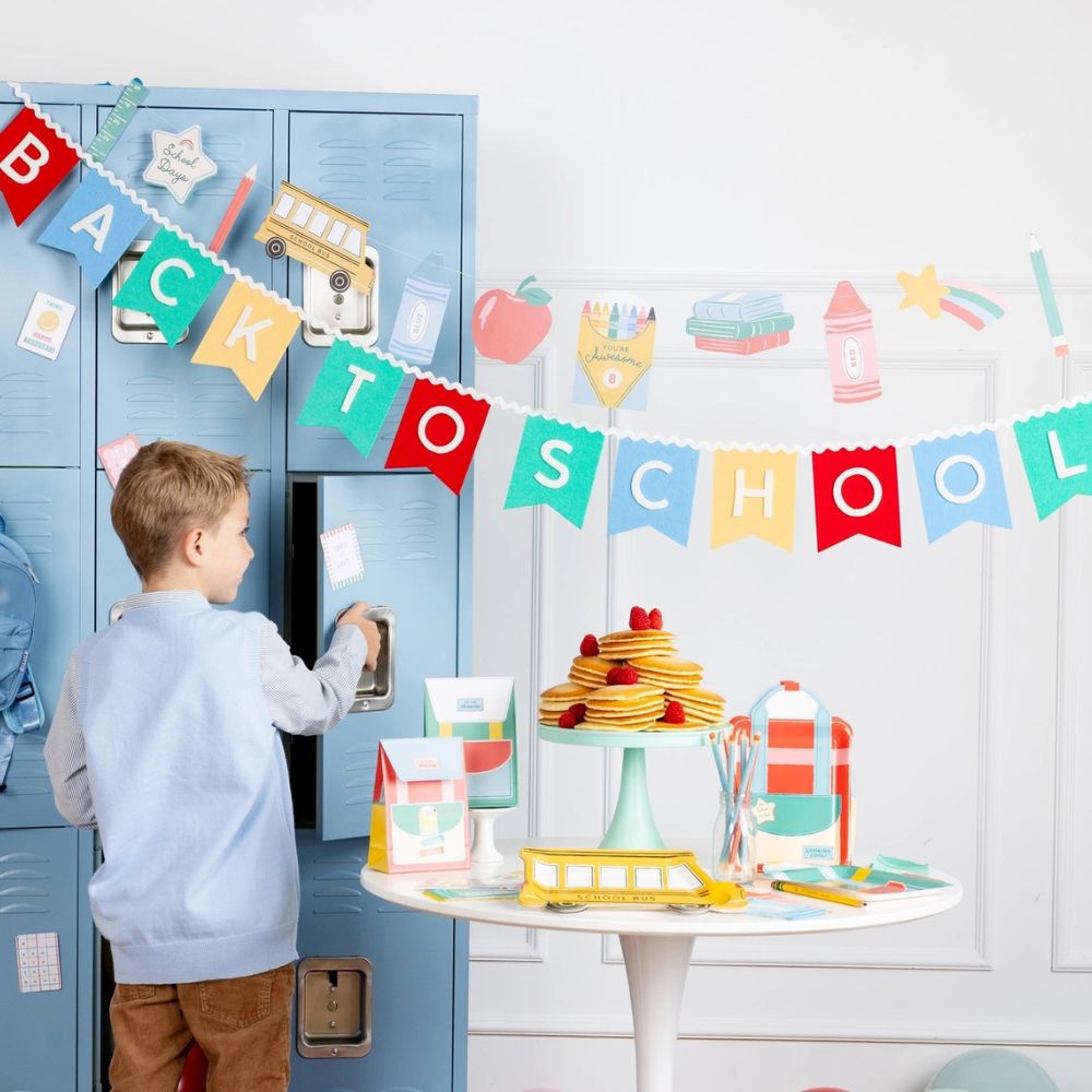 Back to school party setup with icons banner and locker backdrop.