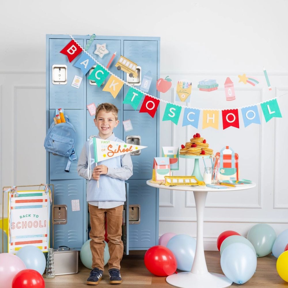 Back to school party setup with pennant and decorations.