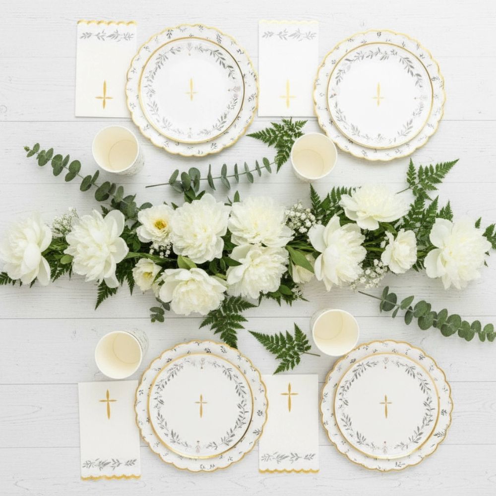 top view of baptism party table with matching plates and decor

