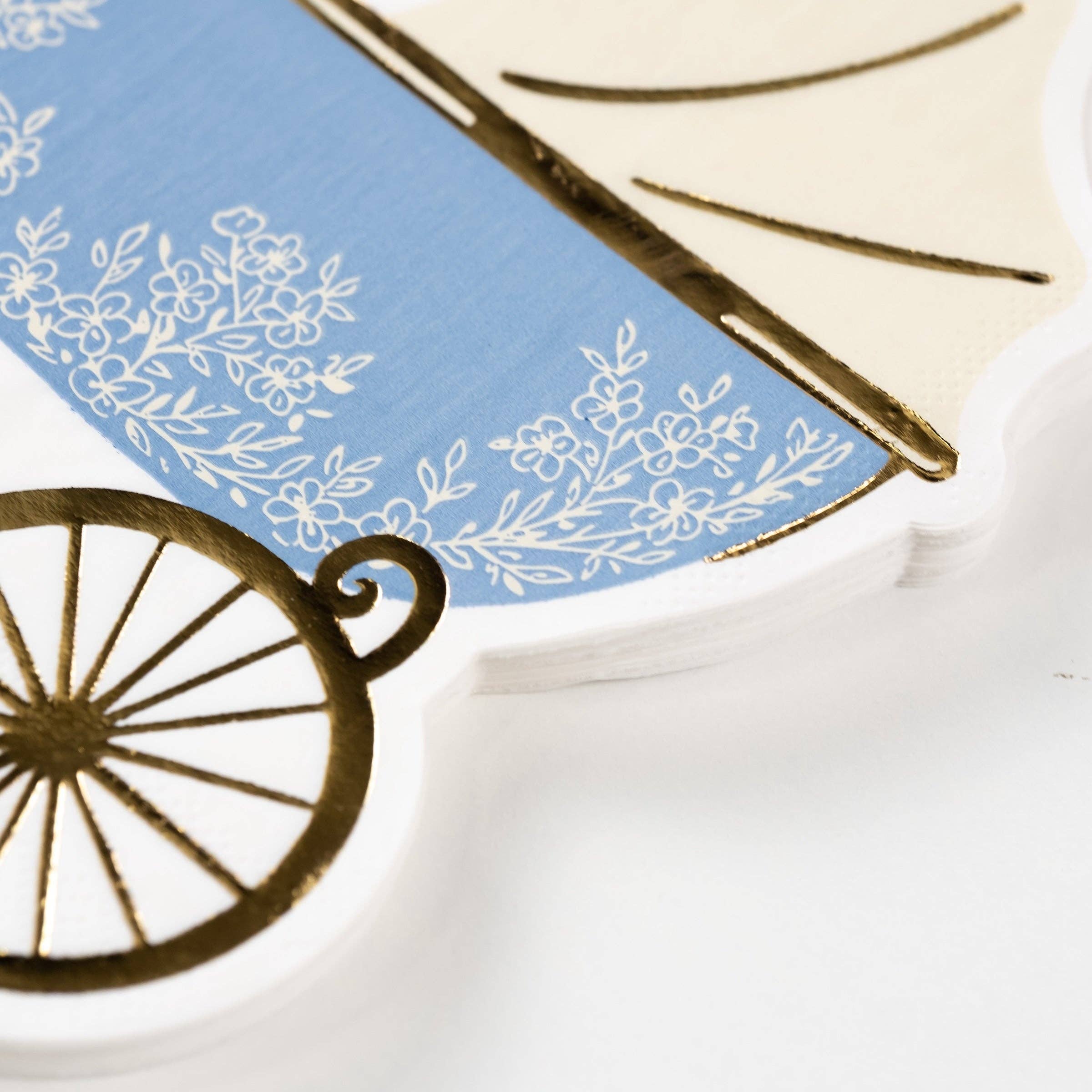 close up of floral detail on blue baby napkin
