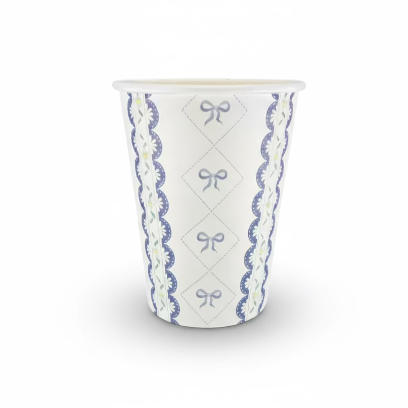 Single paper party cup with blue bow lattice and floral lace pattern