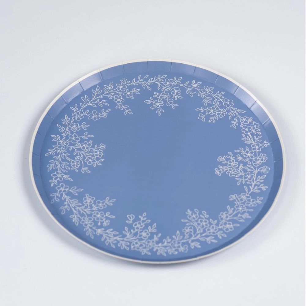 Blue floral paper plates large with botanical print and white rim.
