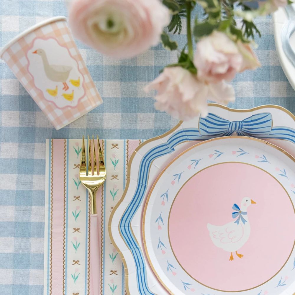 Close-up of blue bow dinner plate with gold foil edge