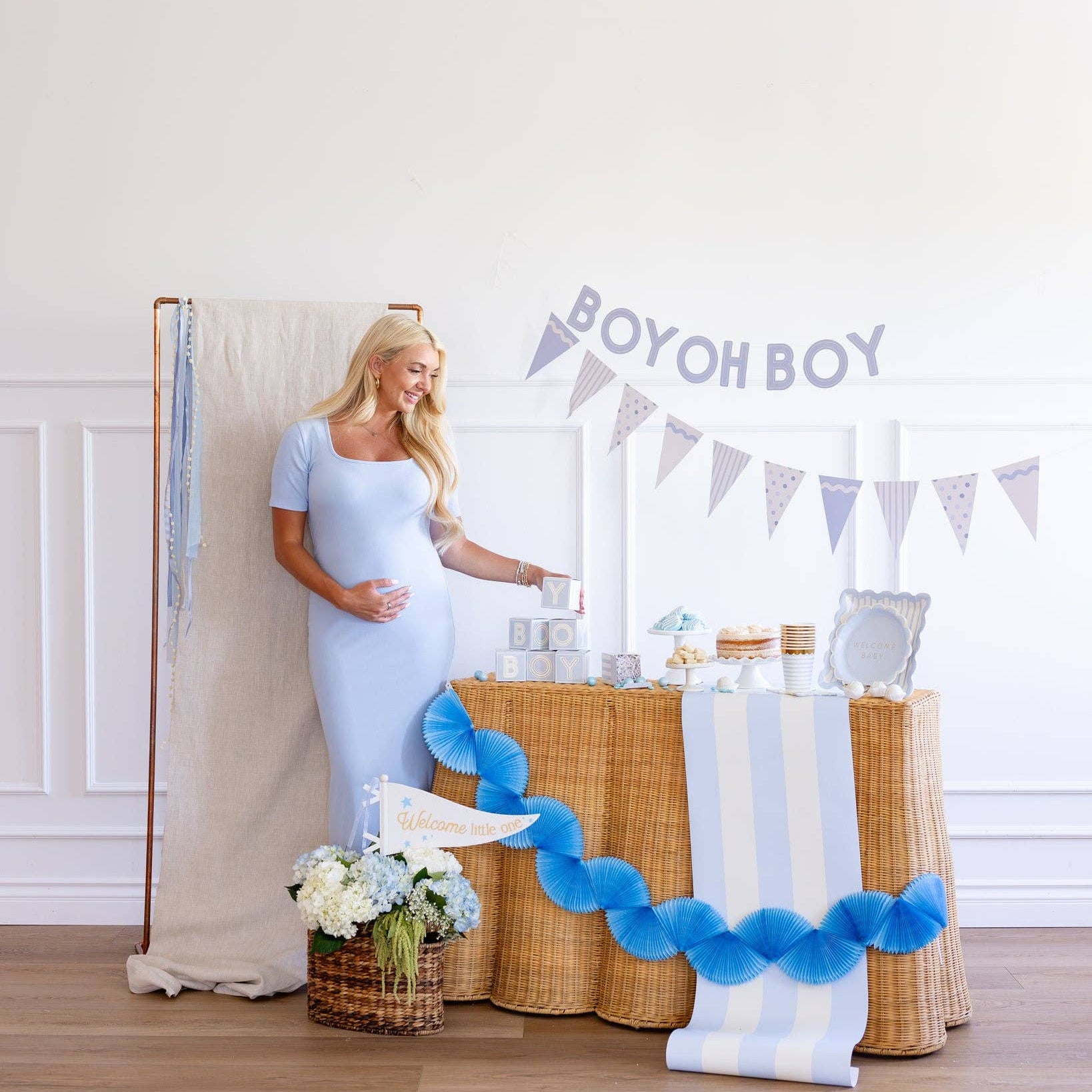 Blue tissue fan bunting used as baby boy shower decoration
