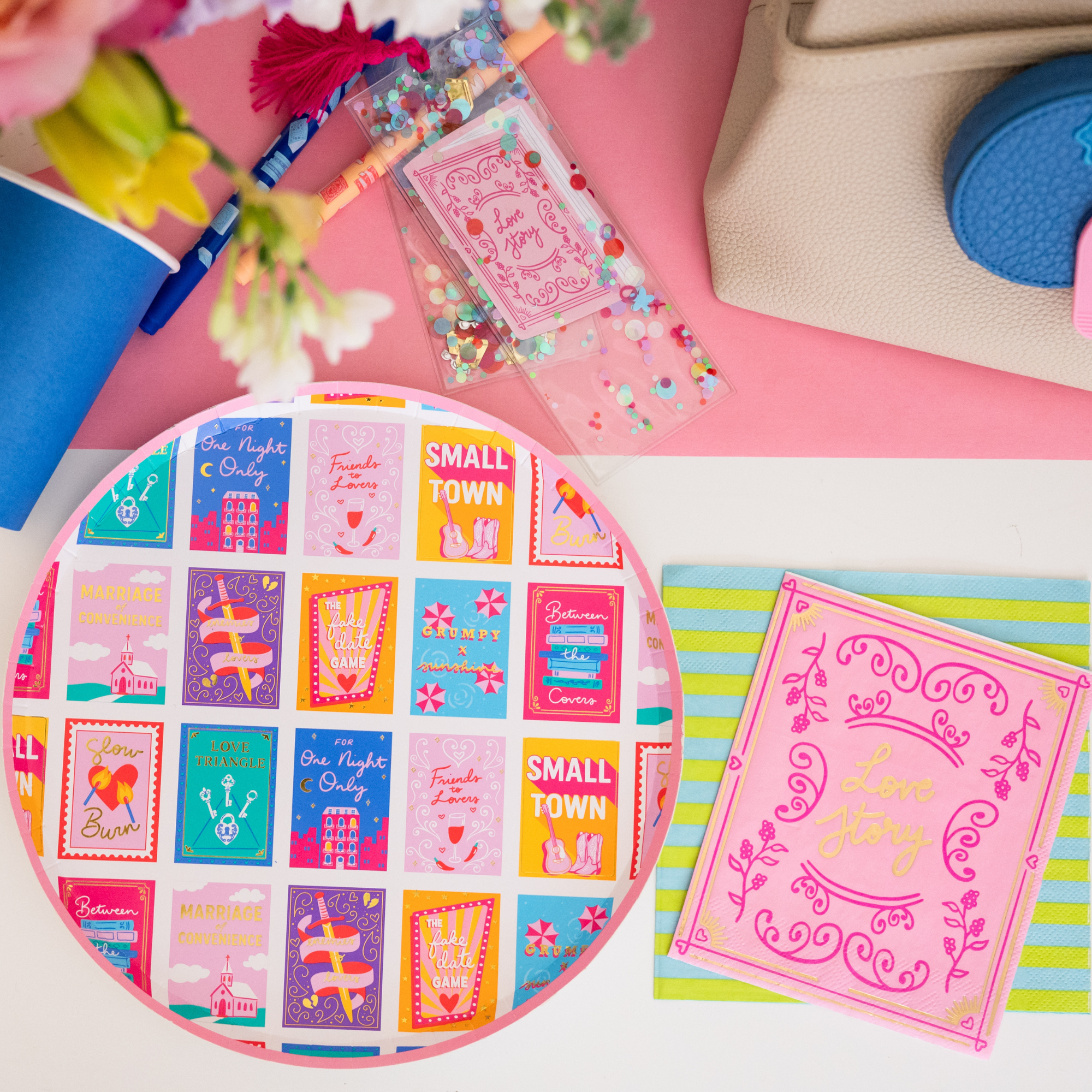 Romcom dinner plate styled with book themed napkins and party accessories