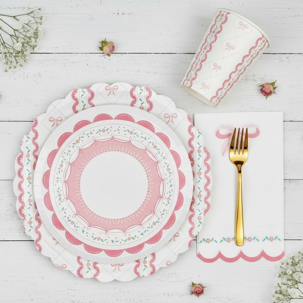 Layered place setting with a small lace plate on top of a large bow plate
