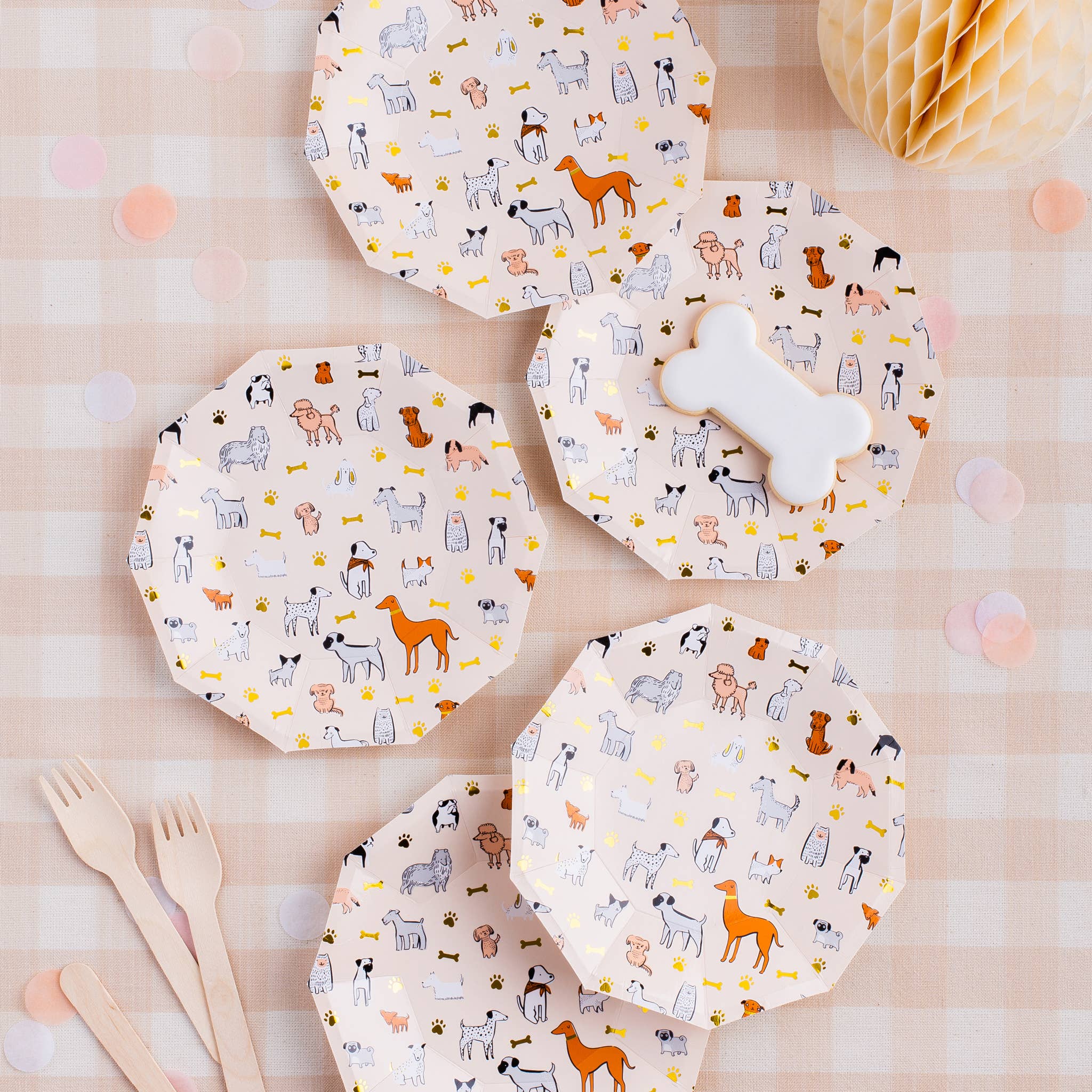Bow Wow dog party small plates styled on table with matching puppy party supplies