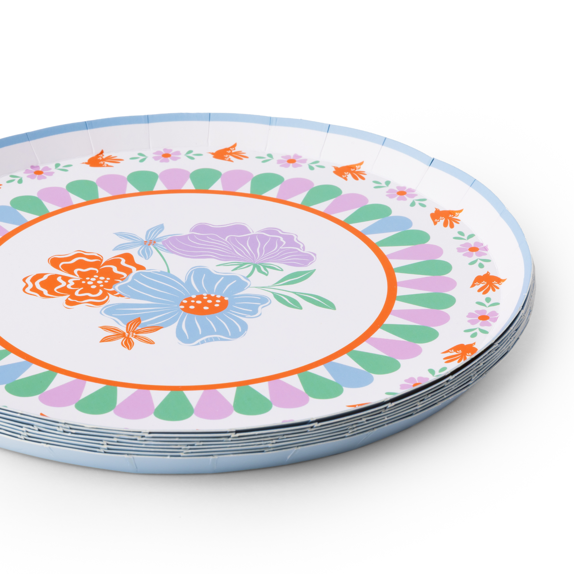stack of bright fiesta small paper plates showing colorful floral pattern