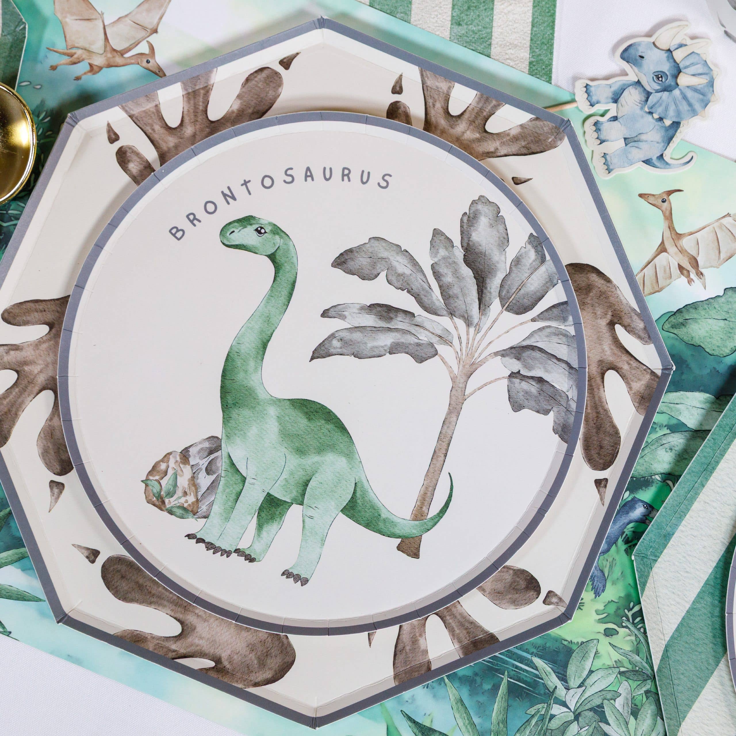 Brontosaurus plate layered with jungle themed party decor
