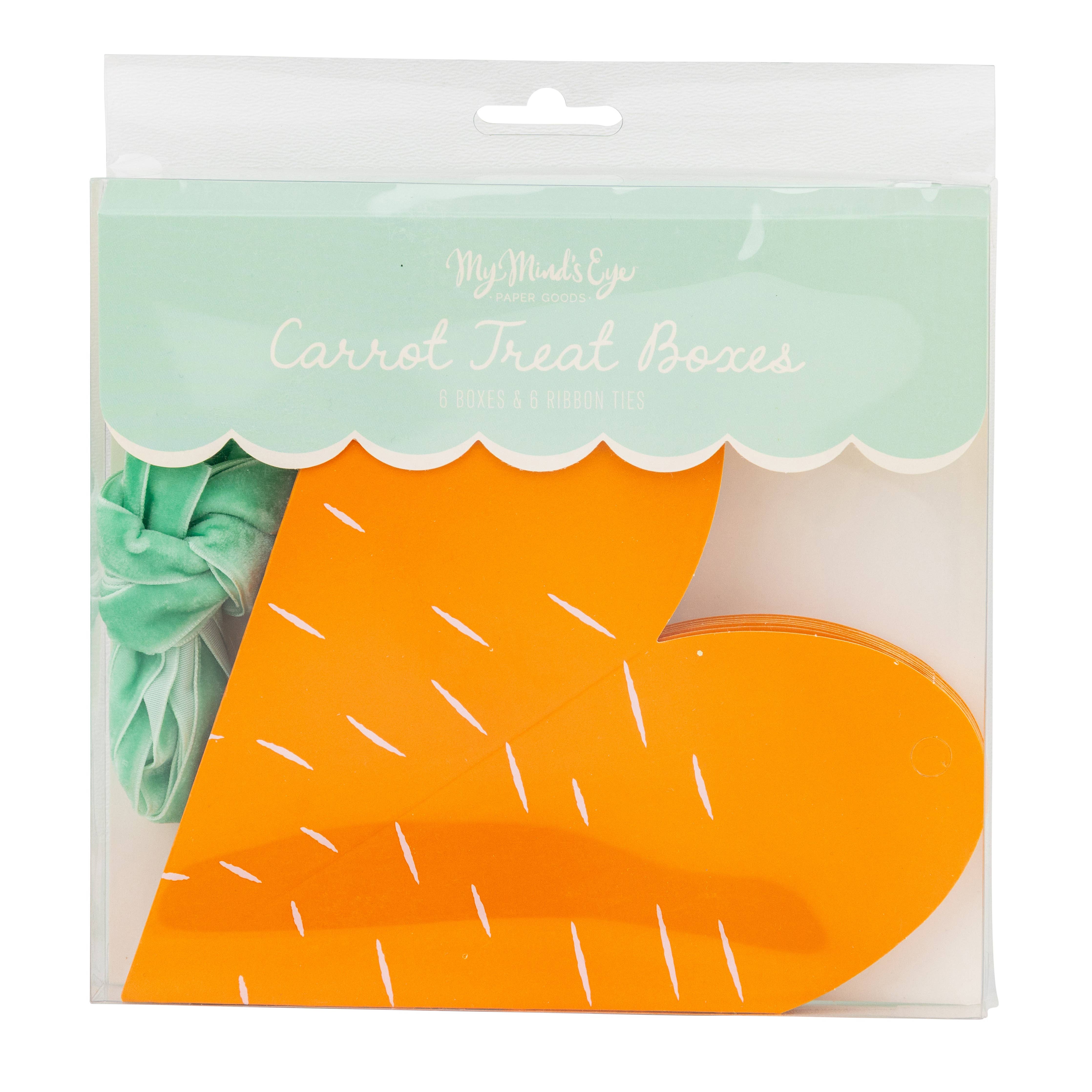 Retail packaging showing carrot treat boxes and green ribbons inside clear bag