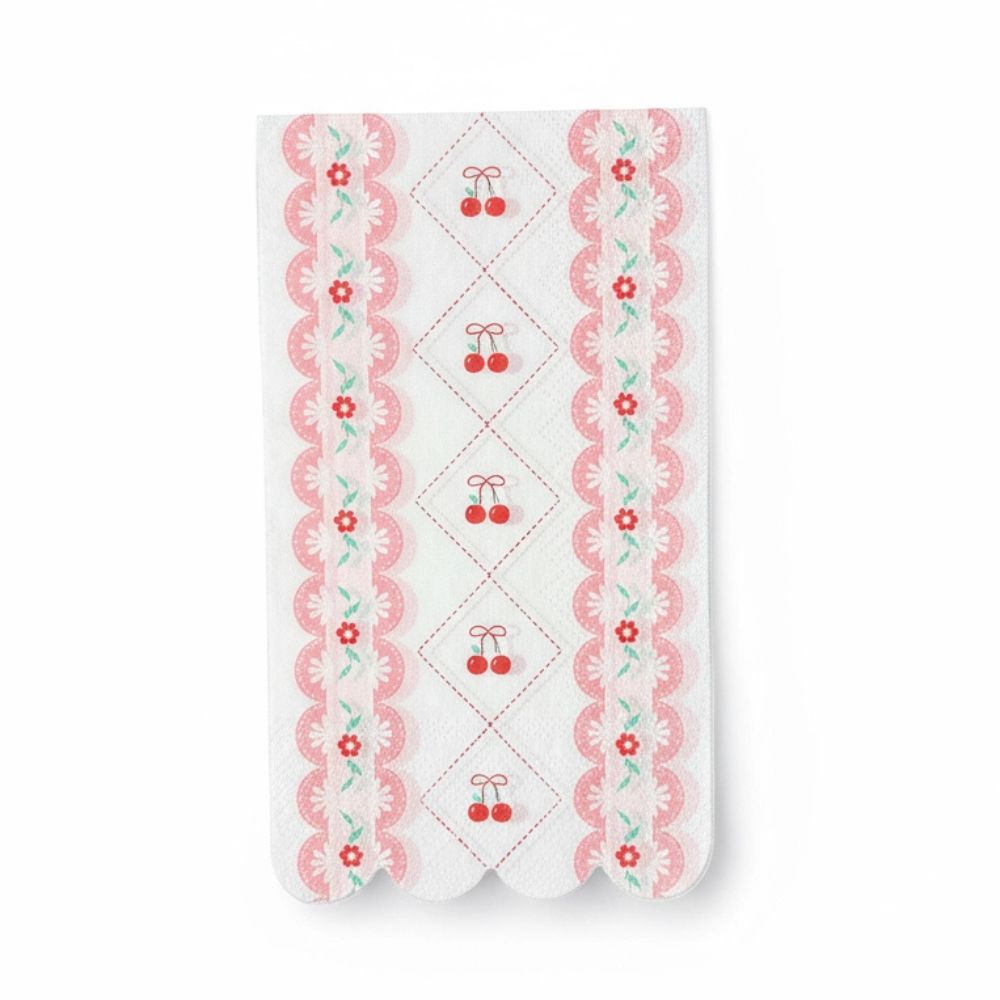 Single white luncheon napkin with red cherries and a pink scalloped floral edge