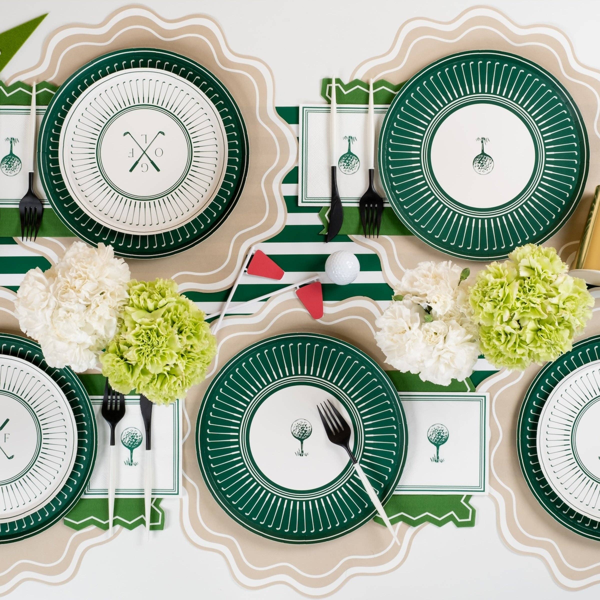 Golf-themed party table with clubhouse green plates and runner