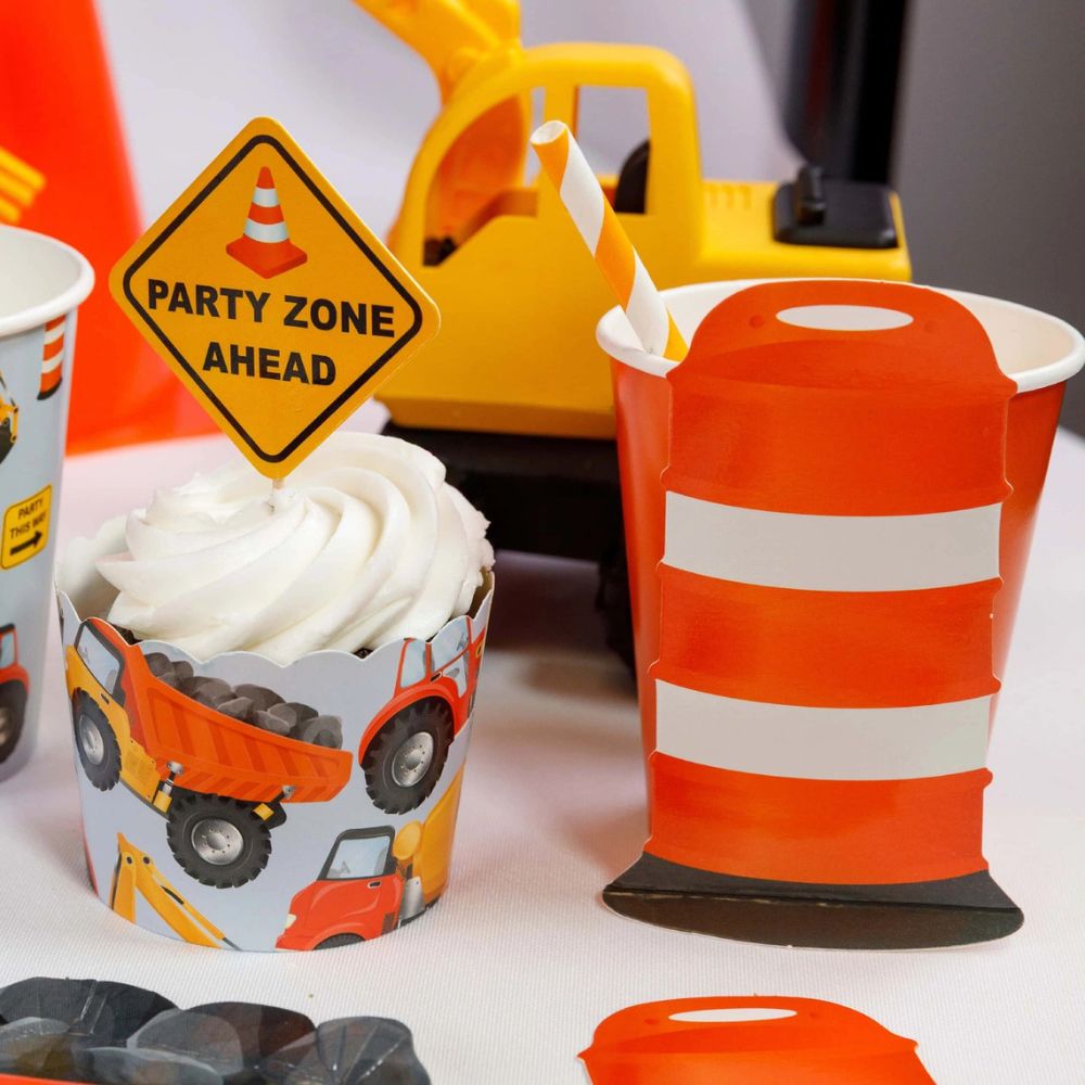 construction party table with barricade cup and cupcake topper
