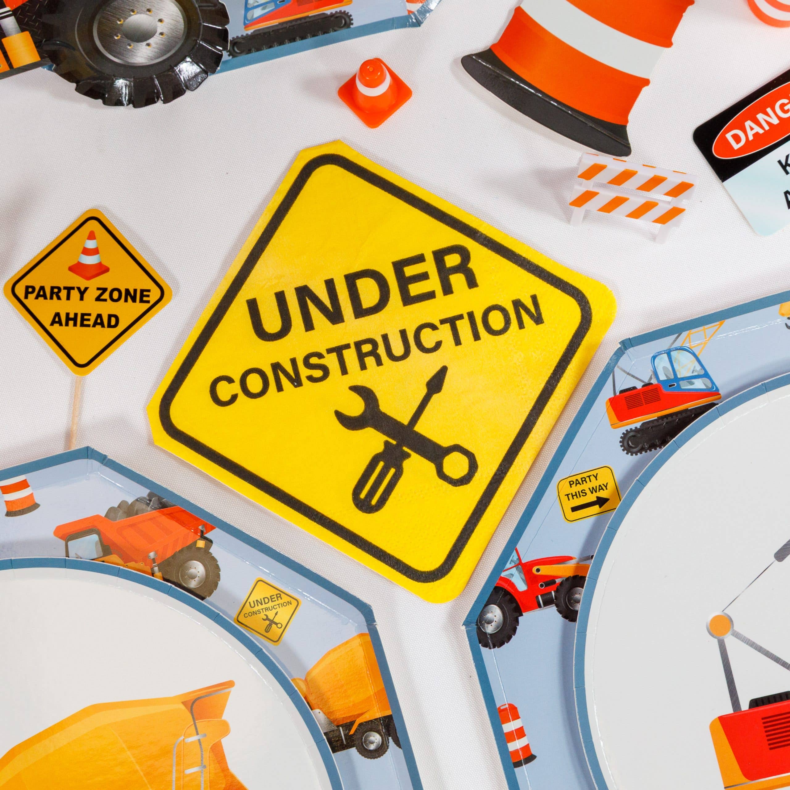 construction themed table with napkins and plates