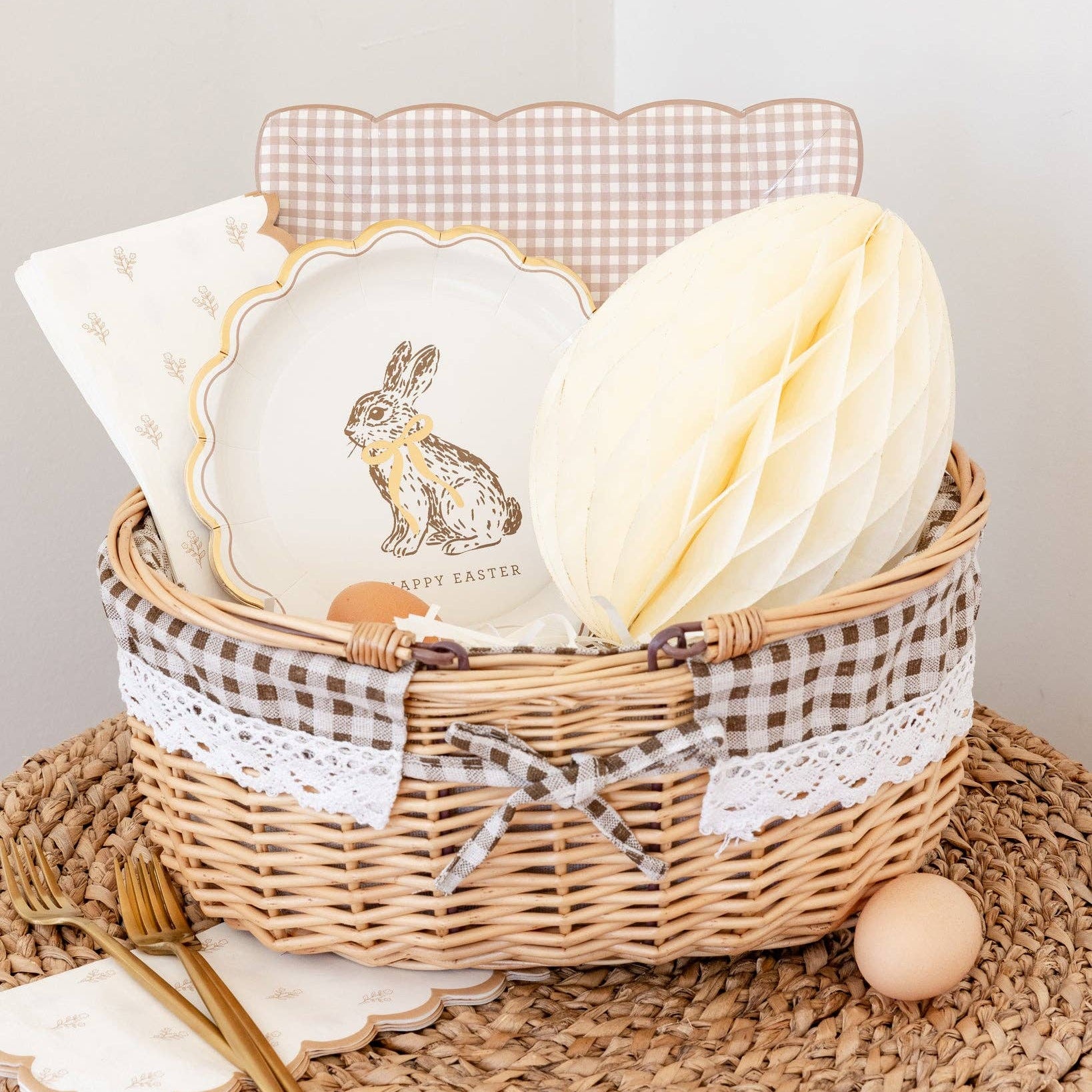 Cottontail Easter table setting with floral napkins, bunny plates, and honeycomb egg decor